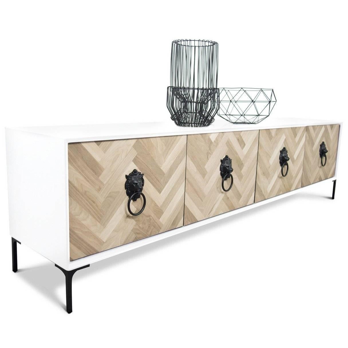 Introducing our newest addition to the Amalfi collection. This four-door credenza features hand-cut walnut chevron detail and white lacquer case finish with lion head hardware.
 
Dimensions:
84