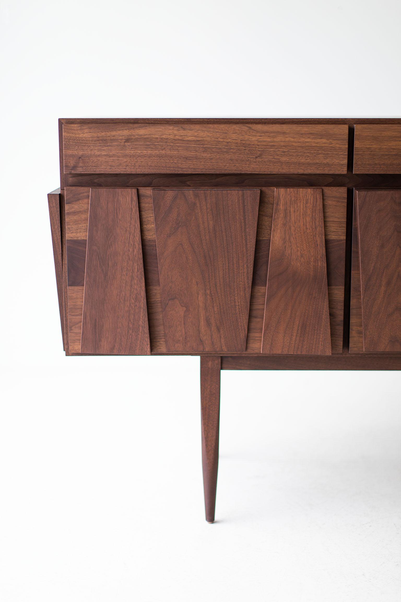 Modern Credenza - 1607 - Craft Associates® Furniture is expertly crafted. The base is constructed by hand from hard wood and not machine. The walnut is then shaped by artisans and finished with a hand applied oil. This piece is also available in