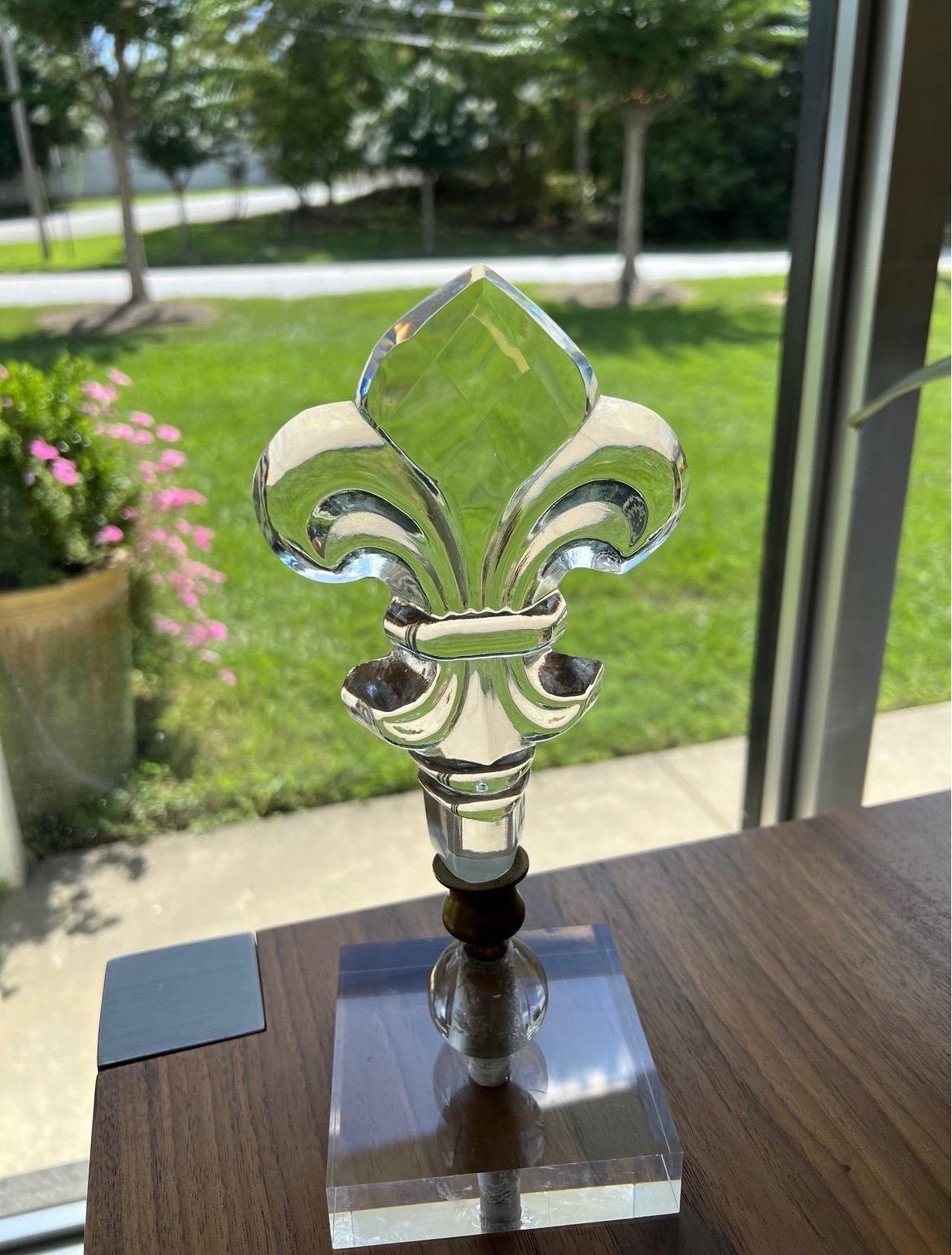 Beautiful glass fleur de lis finials previously architectural salvage and mounted to lucite bases. Several available.