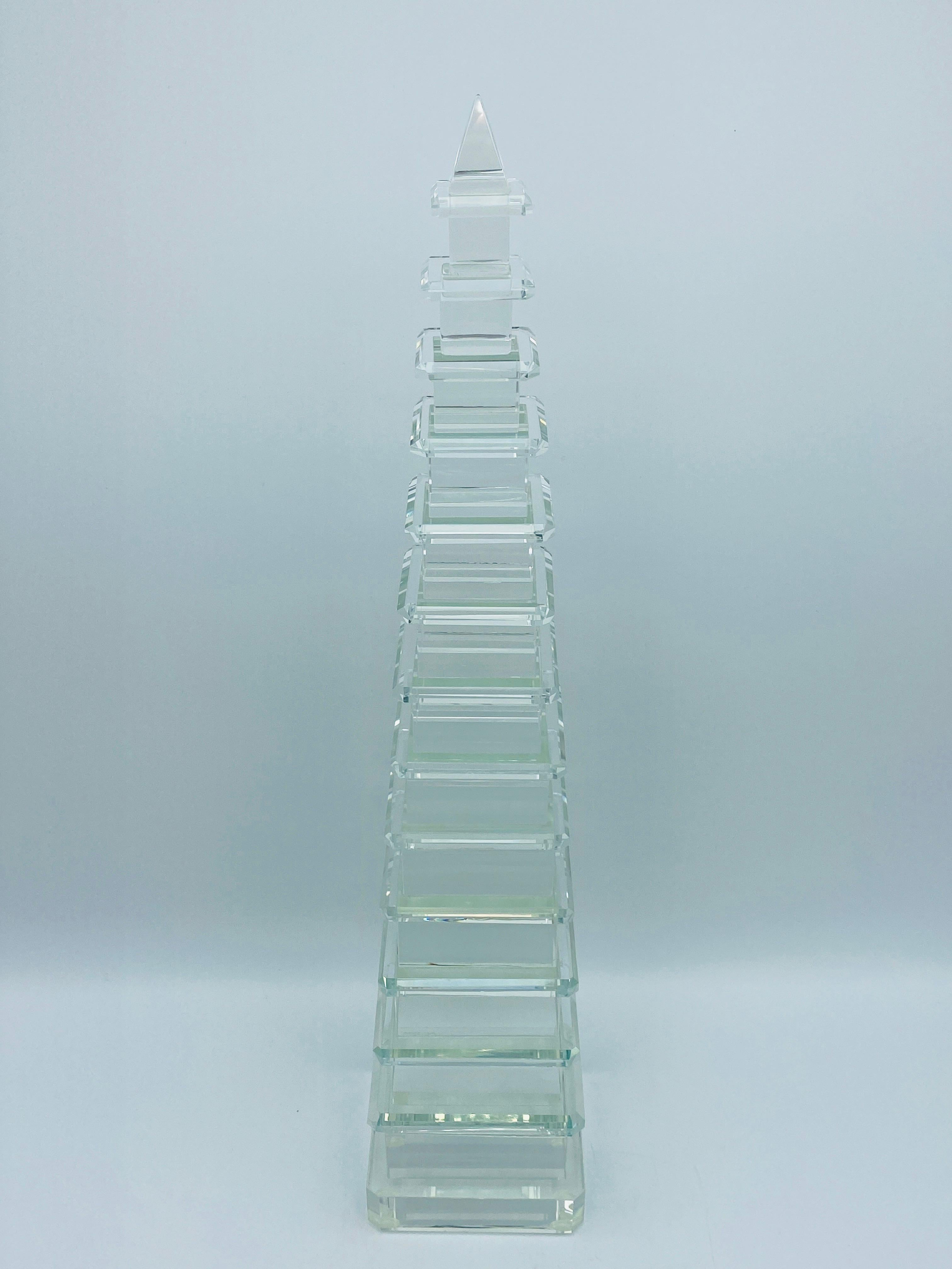 Listed is a fabulous, pair of modern, custom cut crystal chinoiserie pagoda obelisk sculptures, circa 2010s. These would be perfect in any setting - such as, Hollywood Regency, modern, traditional, or chinoiserie! Rubber pads on the underside.