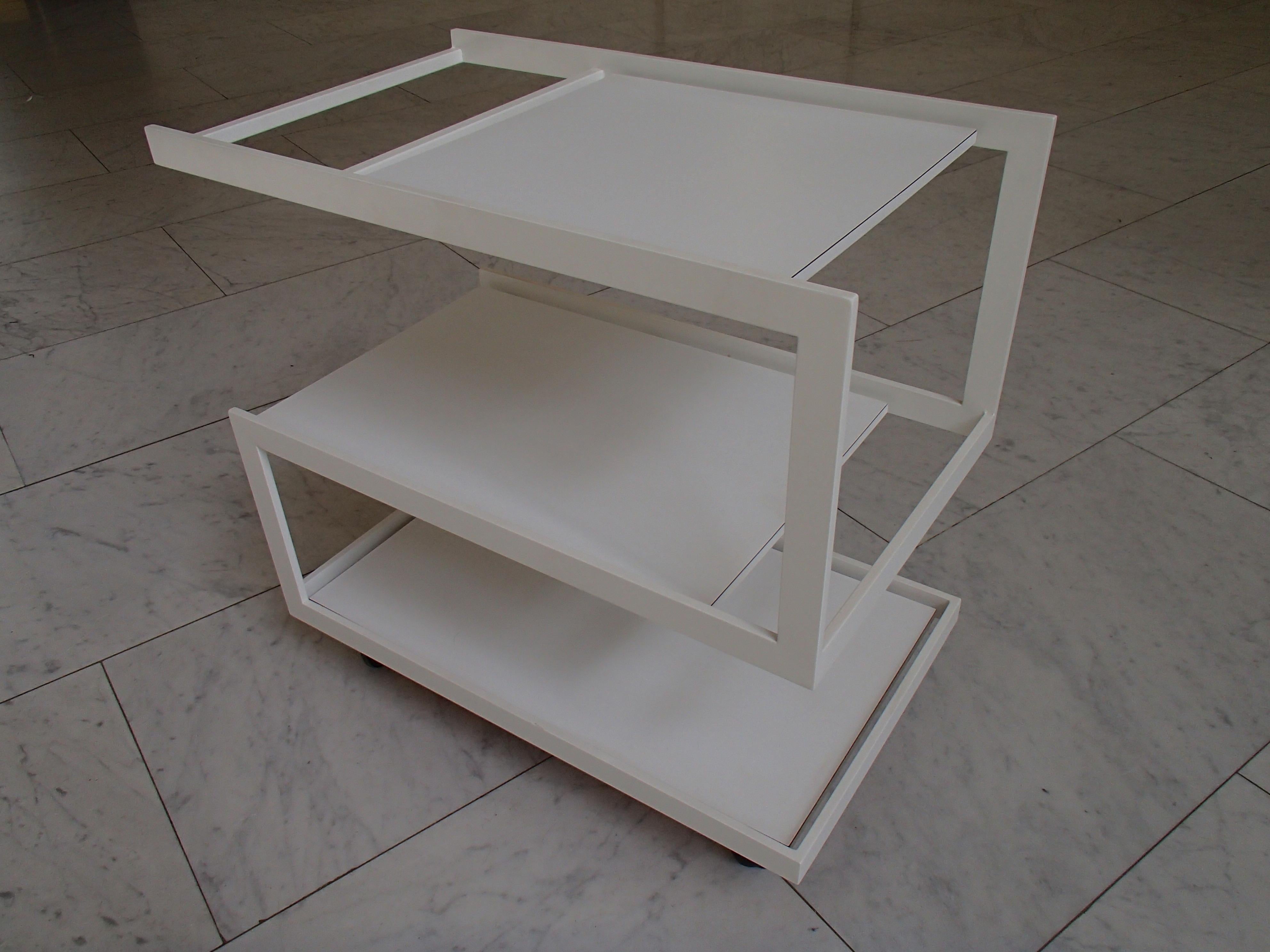 Very elegant modern cubist white trolley 3 shelf's white metal frame and wood shelf's.