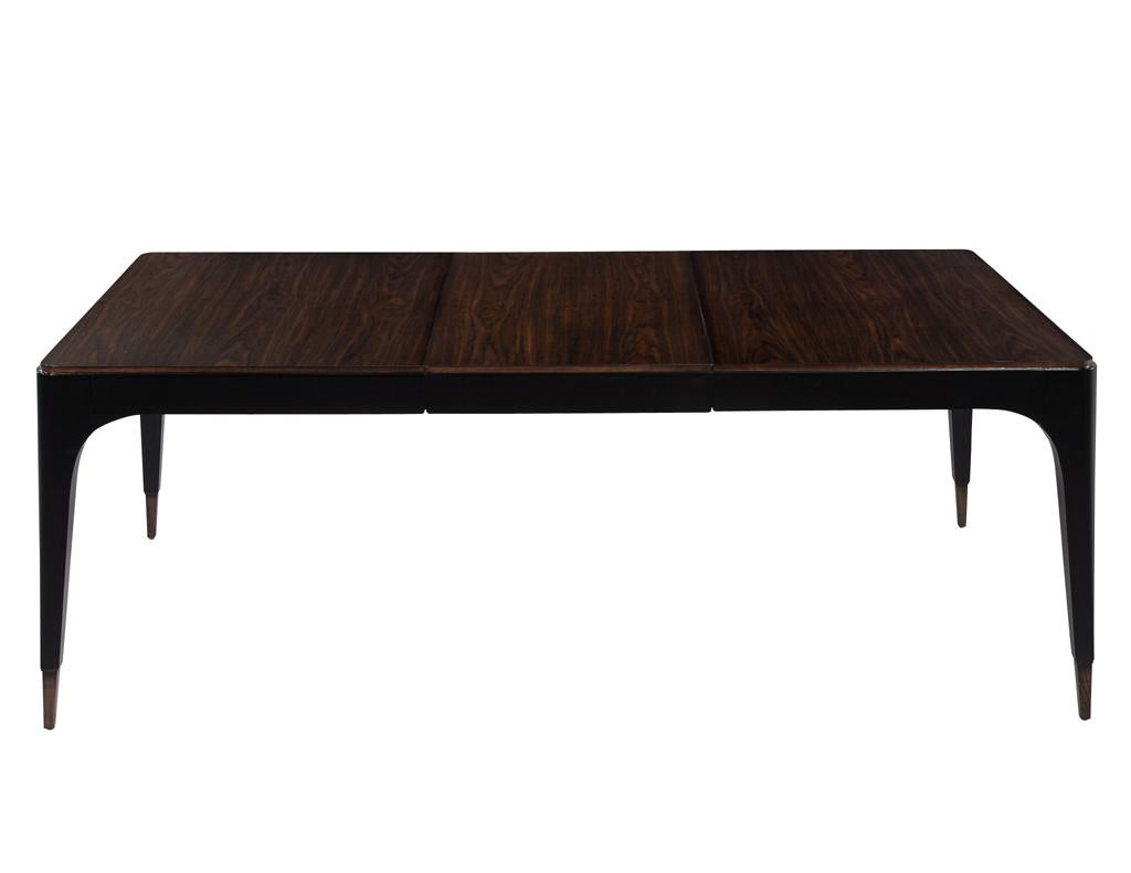 Proudly made in the USA, crafted with the highest quality walnut woods. The table features unique curved corners and tapered legs that not only provide sturdy support, but also add a sleek and modern touch to the overall design. The step edge detail