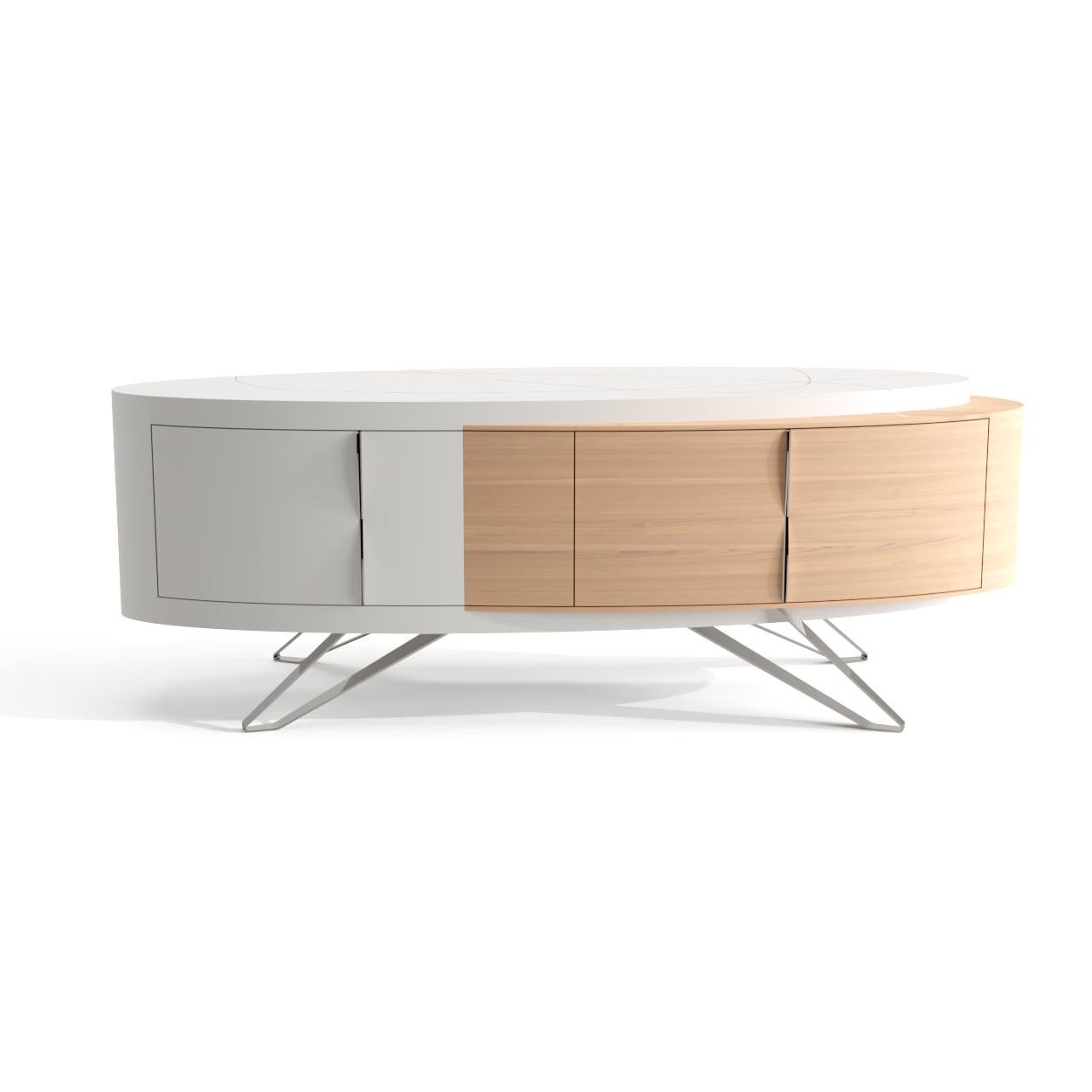 This sideboard is the star piece of the Orbit collection and is perfect for relaxed home designs, full of light and personality.

It has an oval shape, with oak wood and white lacquered wood interconnected on its body and four front doors. The feet