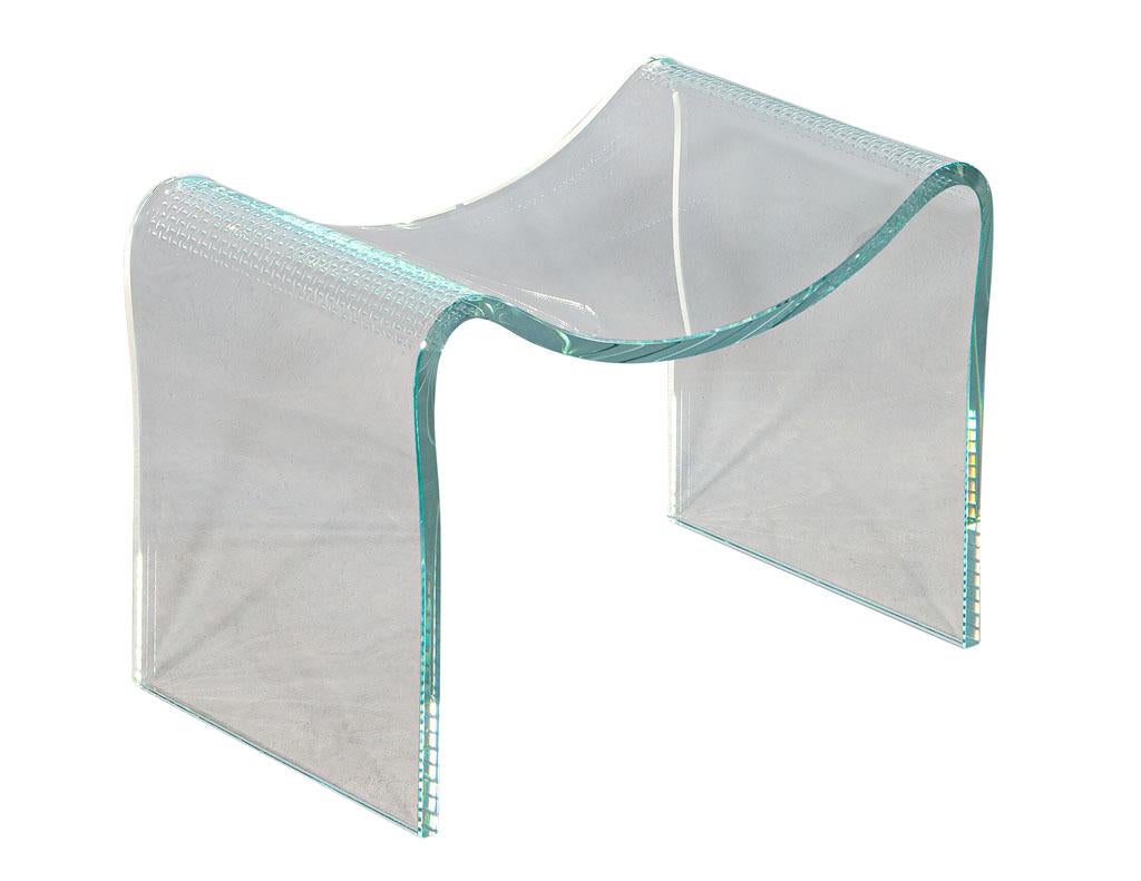 Modern curved glass vanity bench stool seat. Original glass bench with unique modern shape and perforated weave inlay design on corners. In great condition with extremely minor wear considering its age and material. Solid piece of tempered glass.