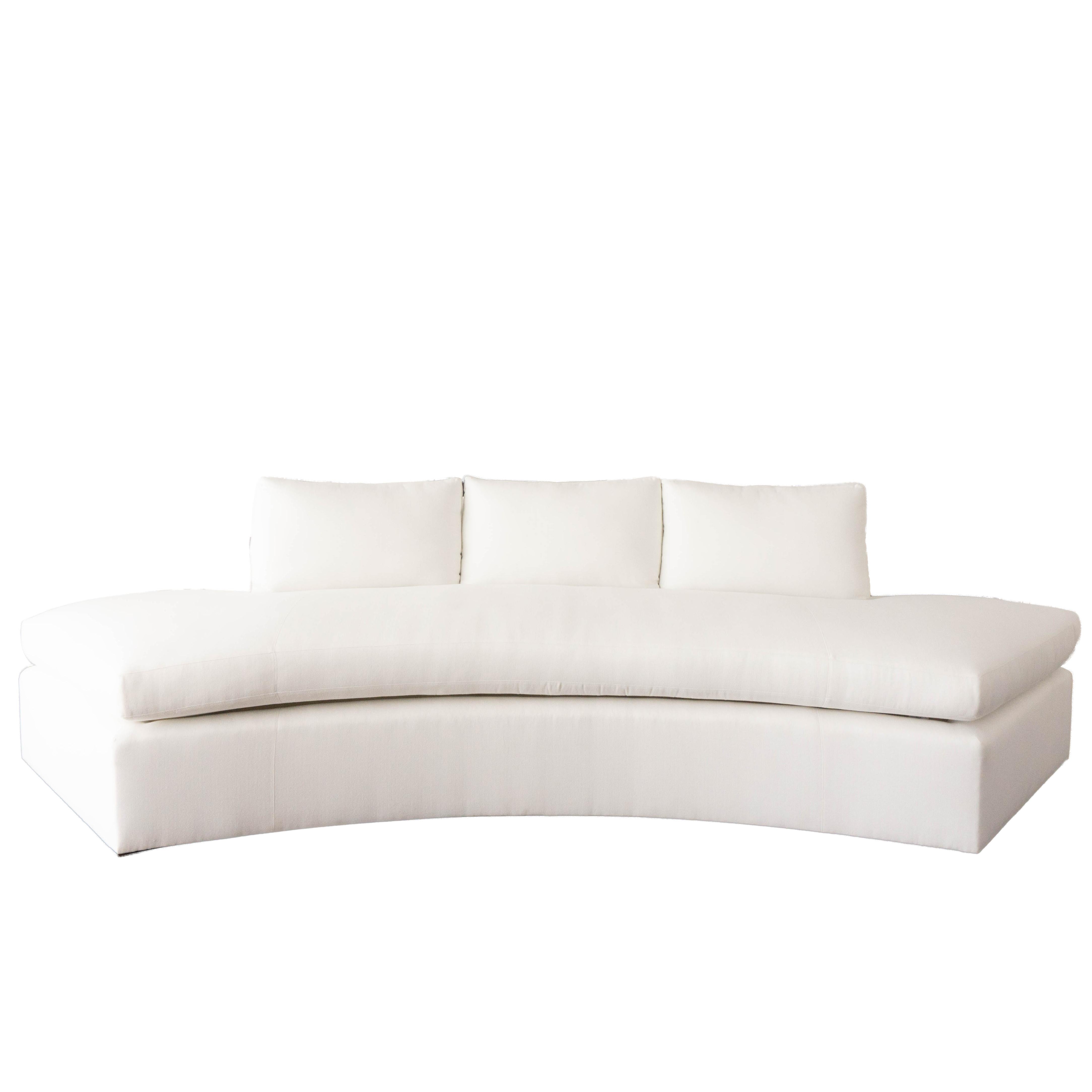 This modern curved sofa is built to order and features 3 loose back cushions with a single cushioned seat. This piece is customizable and can be built to the size specifications of your liking. 

COM (Customers' Own Material) Price: