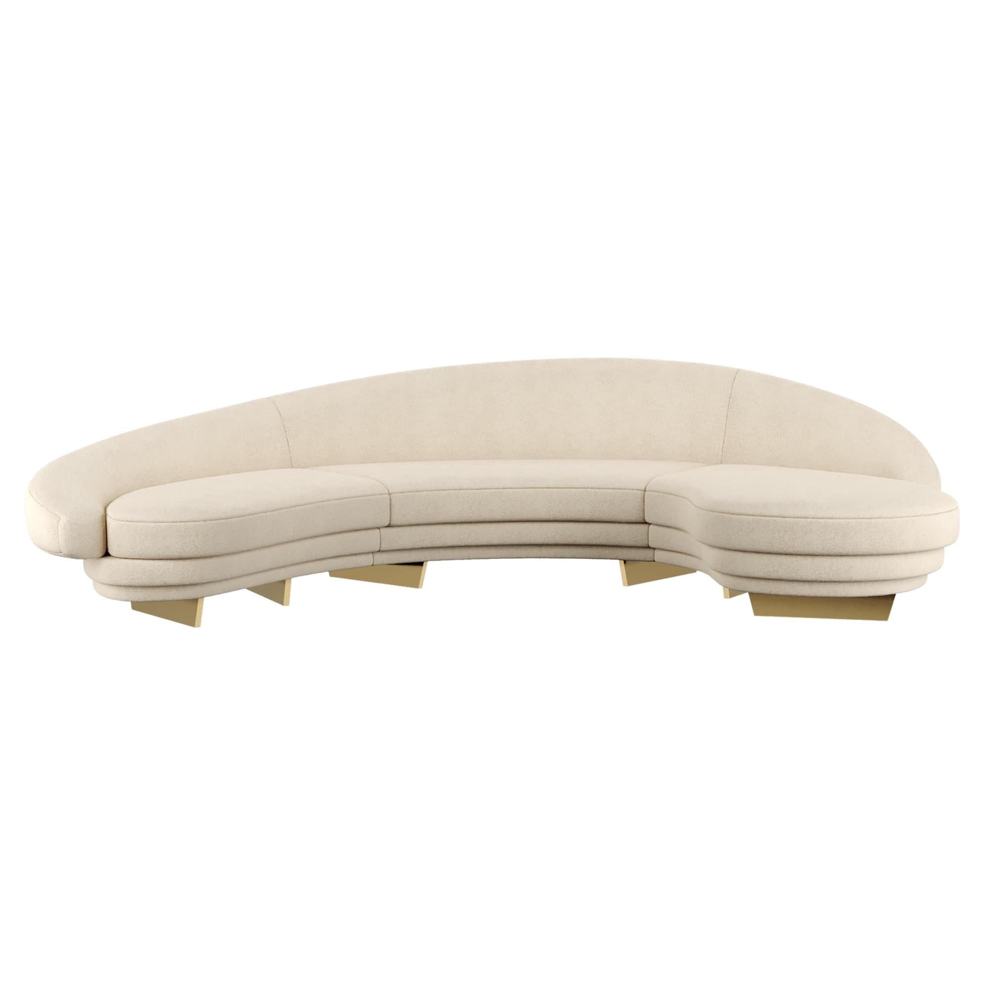 Modern curved serpentine sofa in beige velvet w gold & wood details

Giulia Sofa Nude is a modern mid-century style sofa. This luxury sofa promises to be the absolute protagonist of a modern living room project. Its mid-century style inspiration