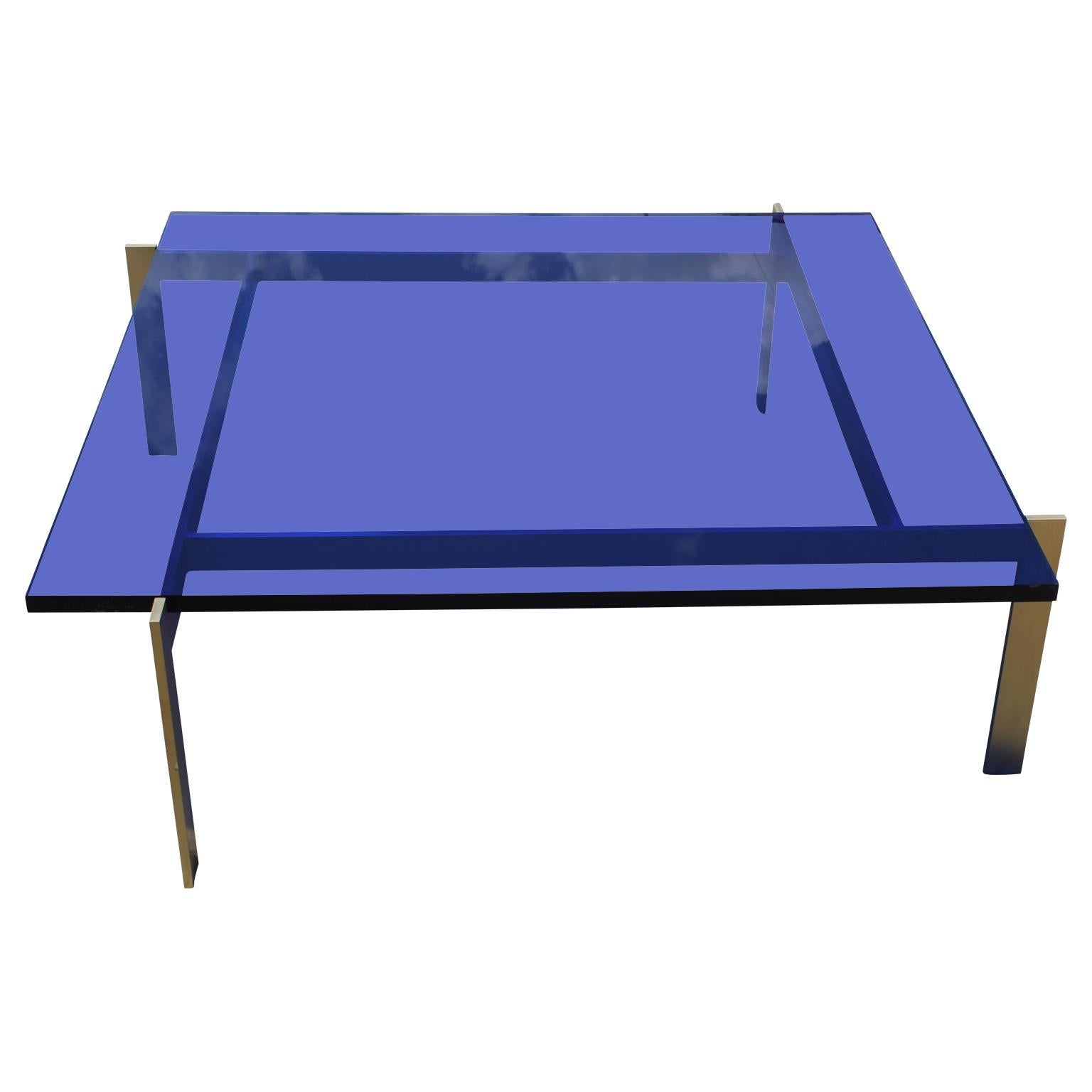 Modern custom-made coffee table featuring a 1 in. thick square blue Lucite or acrylic top with a 2 in. thick solid brass base. Multiple available, including a pink one.