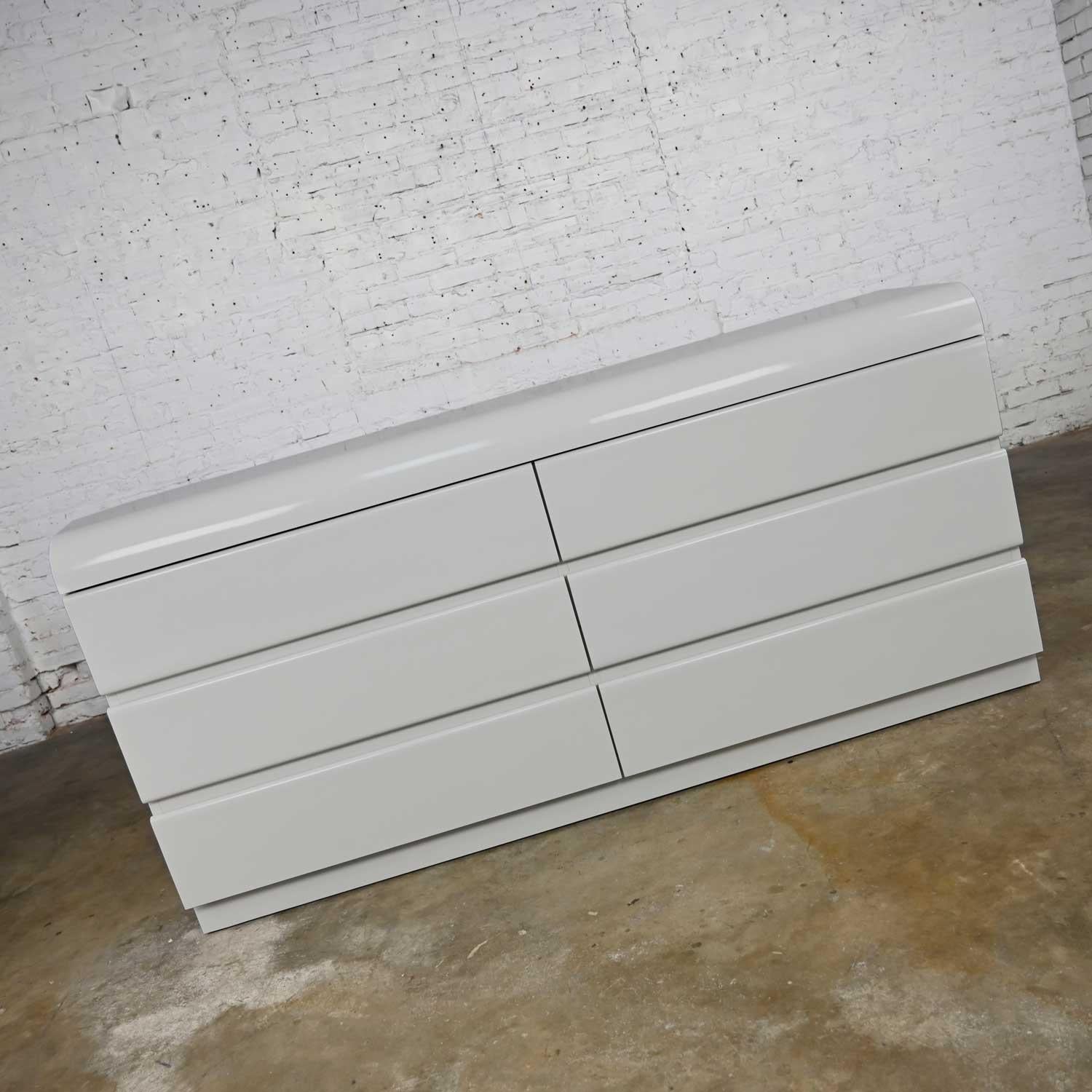 Fabulous modern to postmodern light gray laminate clad high-density fiberboard six drawer custom built dresser by Center Displays Custom Furniture and Cabinets of KCMO. Somewhat in the style of designs by both Milo Baughman and Karl Springer and