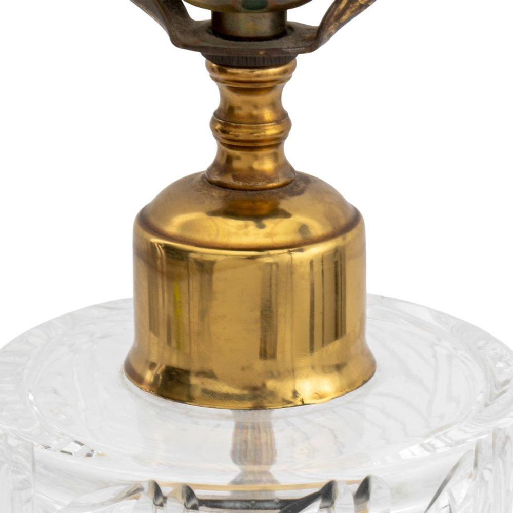 Lampada da tavolo moderna in cristallo tagliato, con corpo cilindrico e terminale in cristallo, montata su una base circolare in ottone. 32