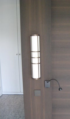 Apparecchio da parete moderno a cilindro in lino e ottone