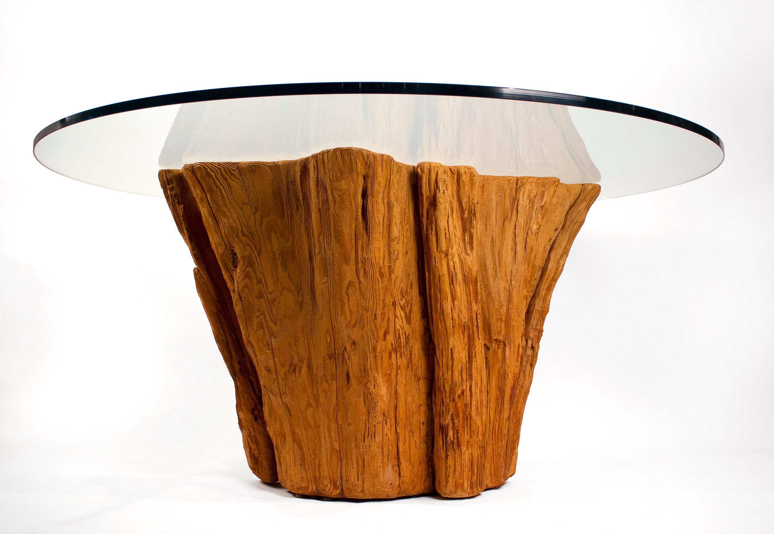 California Mid-Century Modern designer tree trunk table made in the 1970s from an ancient Cypress tree trunk.

 It would serve as a nice dining table, game table, or center table. The wood has been sandblasted to expose the striations in the