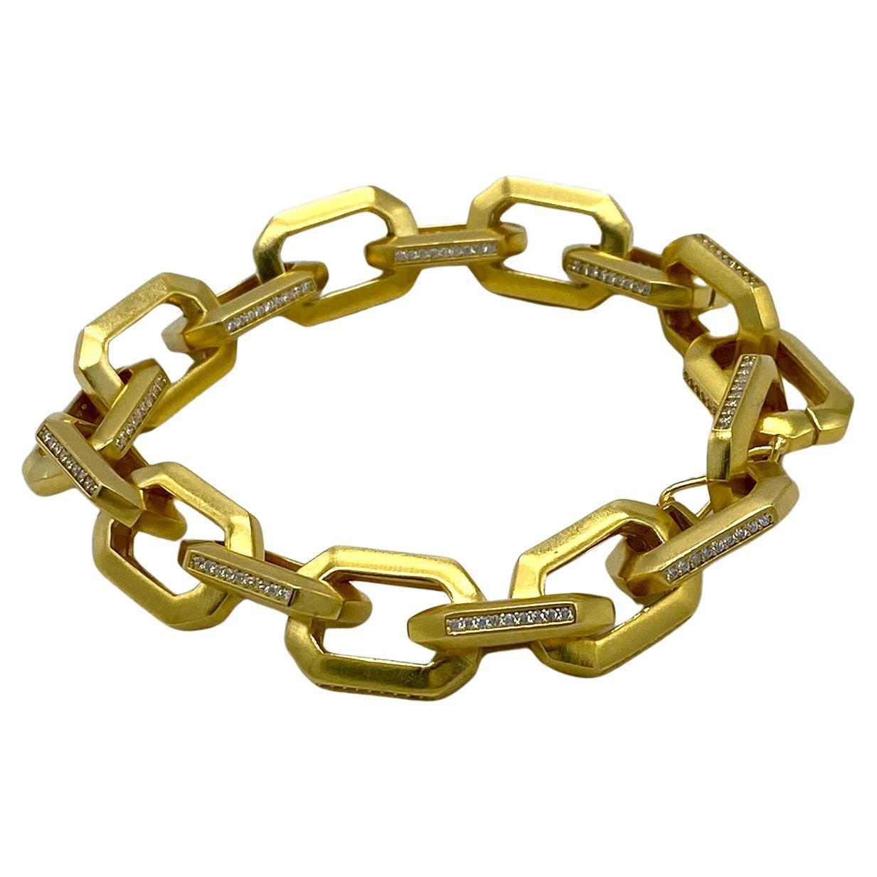 This is a new CZ on gold chain bracelet. This bracelet has heavy gold plated 0.75 x 0.5 large chain decorated with CZ on the sides of the links. It could be men's jewelry. Looks very 80s modern style. 

Our vintage jewelry collection and original