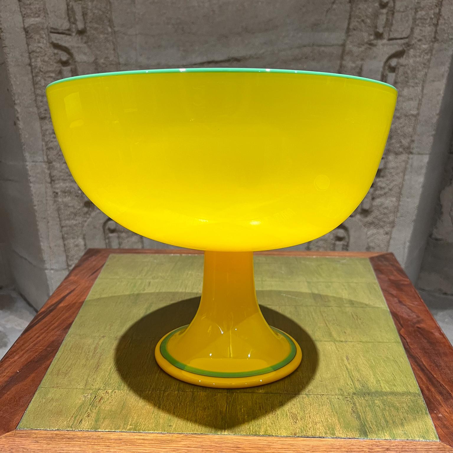 
AMBIANIC presents

Modern Czech Art Tango Glass Yellow & Green Pedestal Art Bowl 
in the style of Michael Powolny Bohemian Loetz Glass
Unmarked.
Oversize
11.38 h x 13.75 diameter
Preowned original vintage condition. High quality display.
Refer to