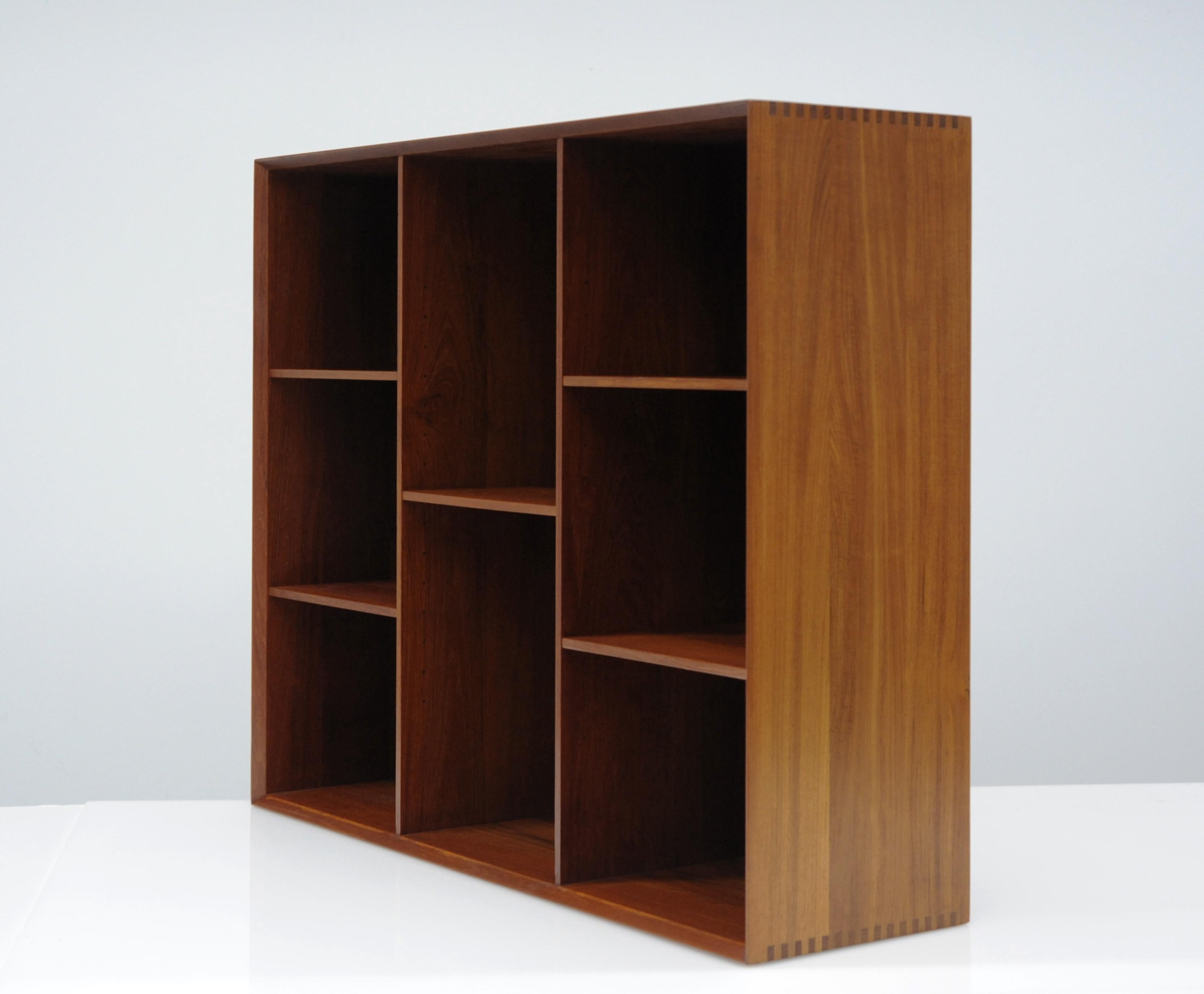 Beautifully constructed bookcase by Peter Hvidt and Orla Mølgaard-Nielsen. Bookcase is clean and in excellent condition. Exposed finger joined details and nice even patina. Bookcase was originally acquired Denmark in 1962. Case is designed to sit on