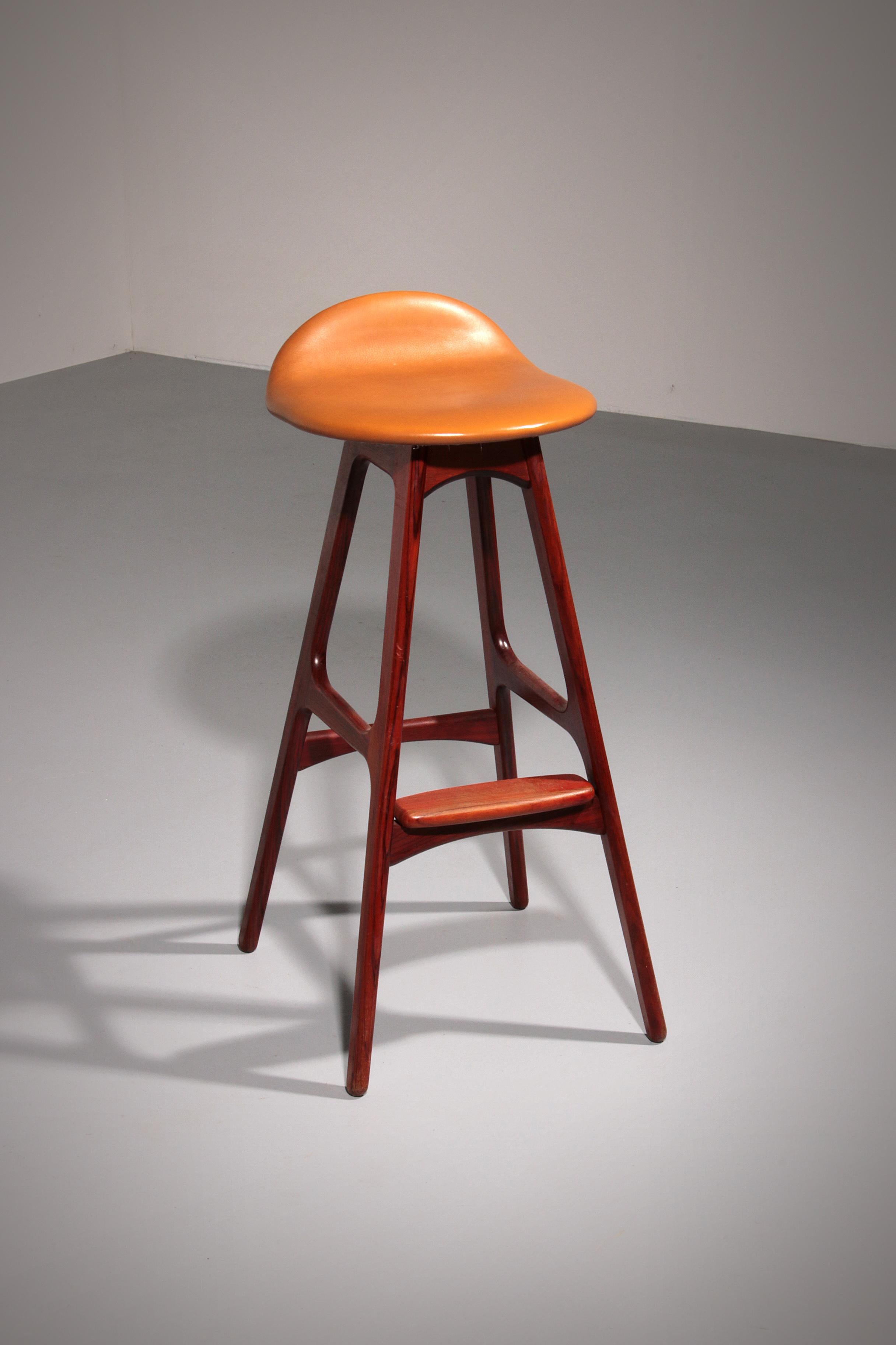

This bar stool was designed by
Erik Buch and produced by O.D. Mobler in Denmark.
In our opinion, this is the most elegant, practical, comfortable and beautiful bar stool ever made. The design is perfect; all materials are of high quality: the
