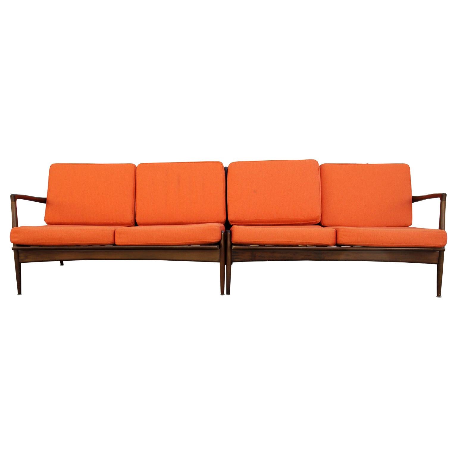 Modern Danish style orange sectional sofa
- Orange sectional sofa with a teak frame
- Modern Danish style design in the style of Kofod Larsen
- Minimal light weight design perfect for upper level spaces
- Comfortable design.