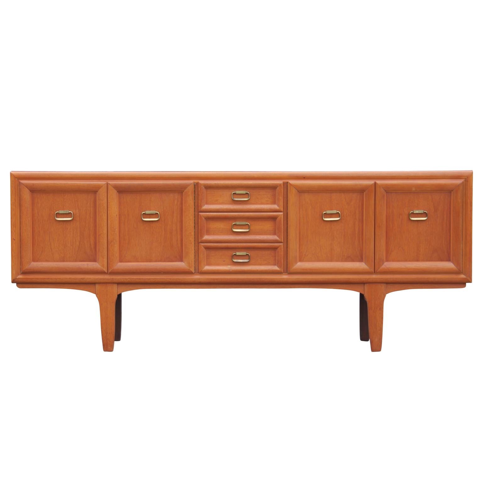 Beautiful modern Danish style teak sideboard or credenza with brass ring handles, circa 1960s.