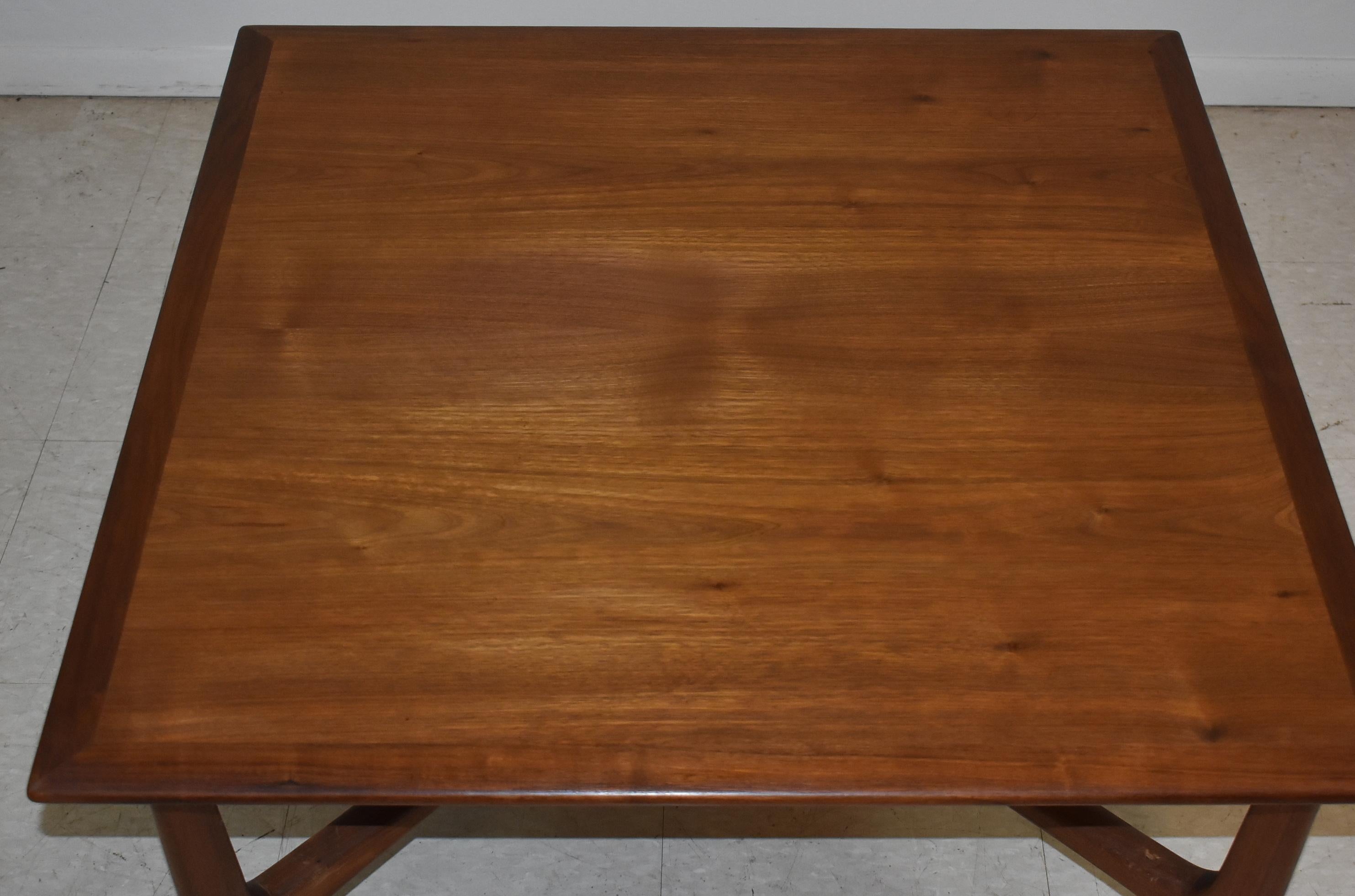 Modern Danish teak coffee table, cocktail table, by DUX. Square. Banded edge with X stretcher. Slight damage to 1 leg cross bar as photo'd, faint ring mark on top. Nice condition. Measures: 32