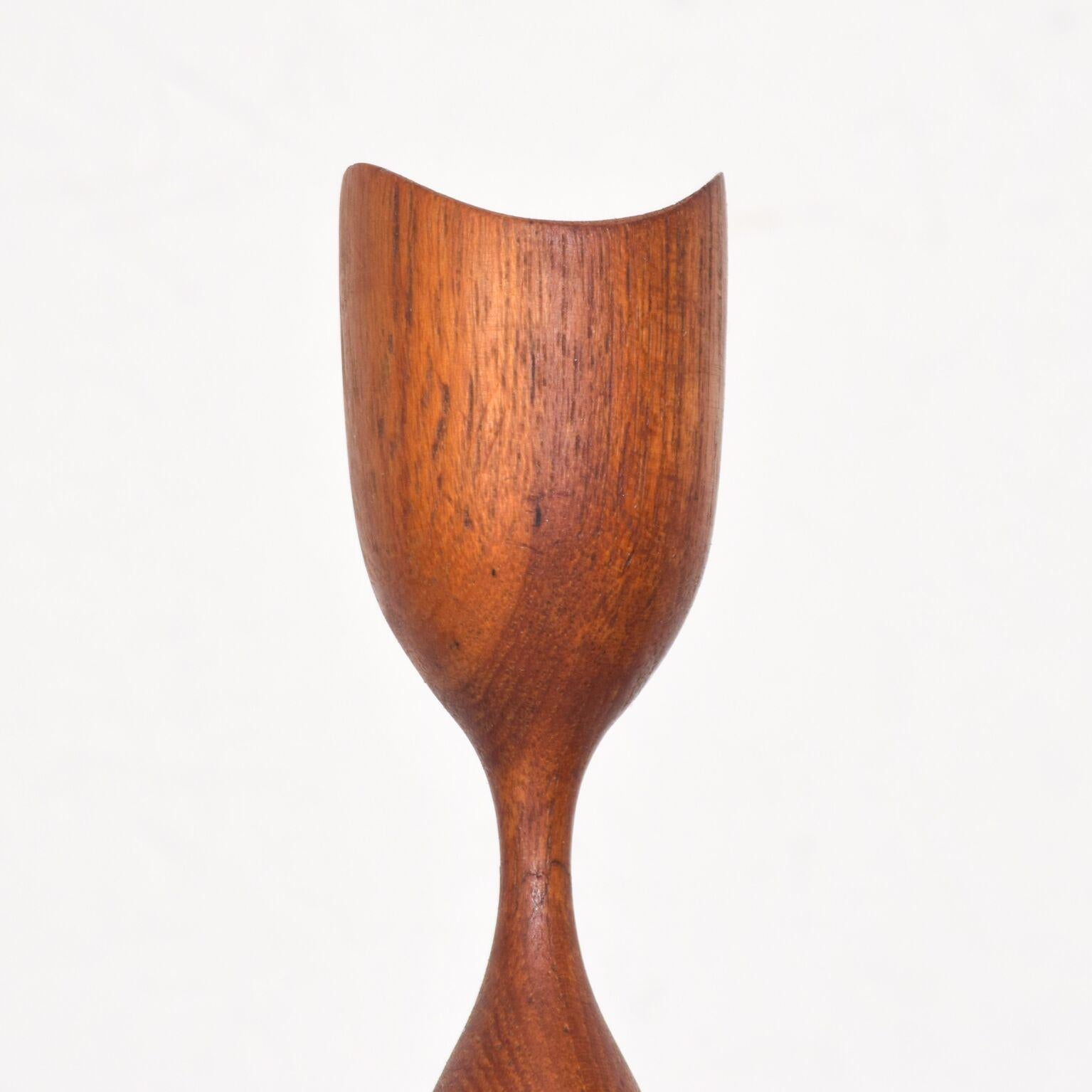 For your consideration: Danish modern sculptural teak tulip wood sculpture is from Denmark. Danish Modern in shape of a tulip. No placement for candle. This is a sculpture. Dimensions: 12