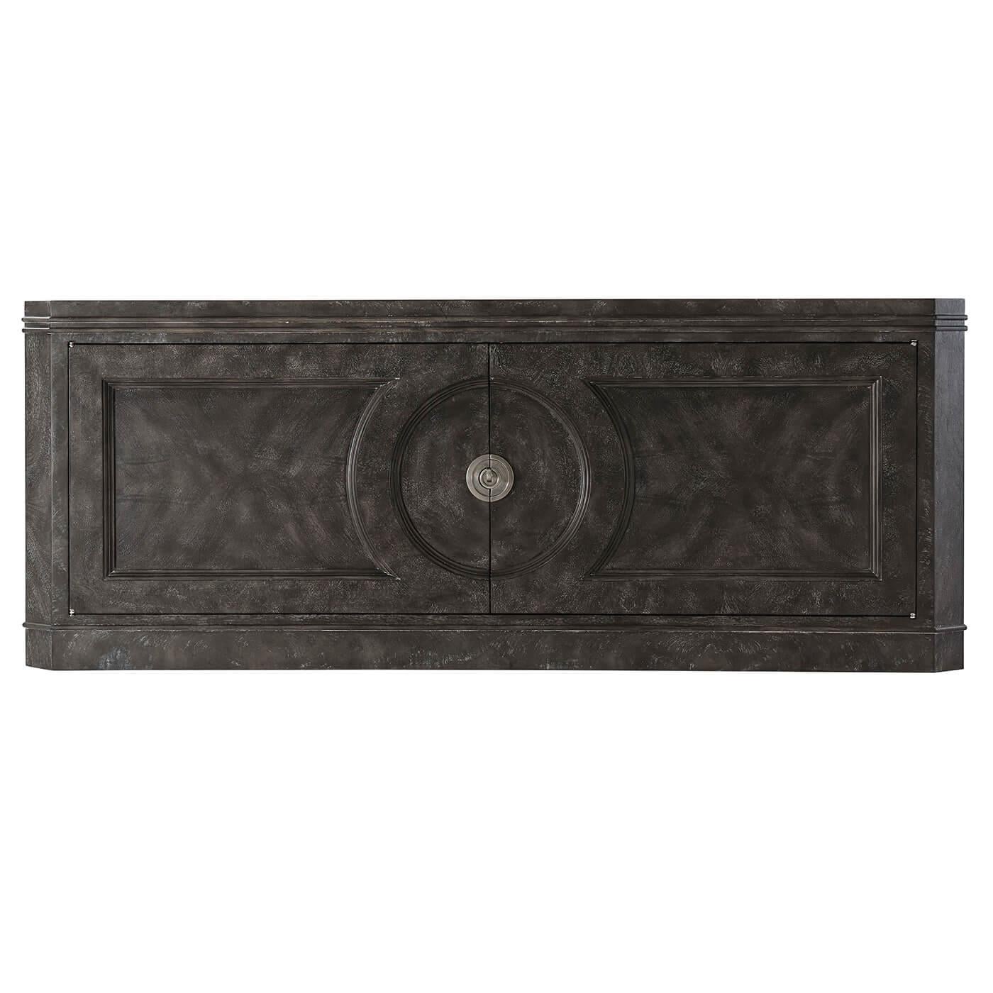 Modern dark ember low cabinet a modern swirl veneer two-door low cabinet. The modern cabinet with cerejeira swirl veneers in a dark ember finish with canted corners having beaded molding details, two relief paneled doors with circular center