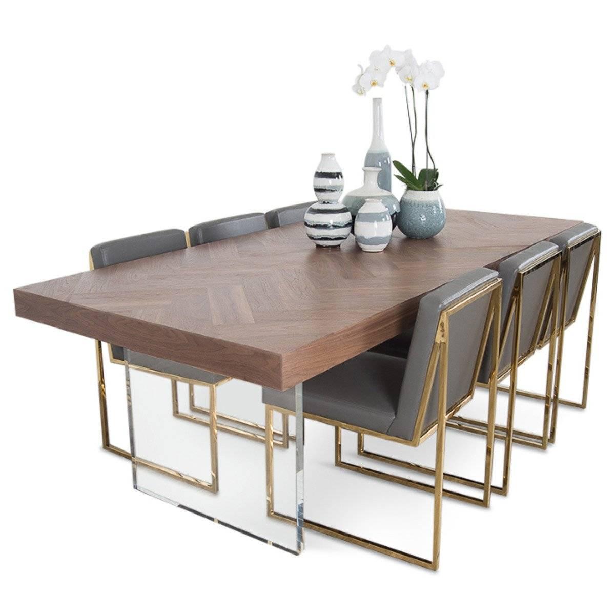 The Amalfi dining table is a wonderful addition to our Amalfi collection. The top is made of natural hand rubbed solid walnut that is carefully laid out in a herringbone pattern. The table is supported with two elegant Lucite plinth