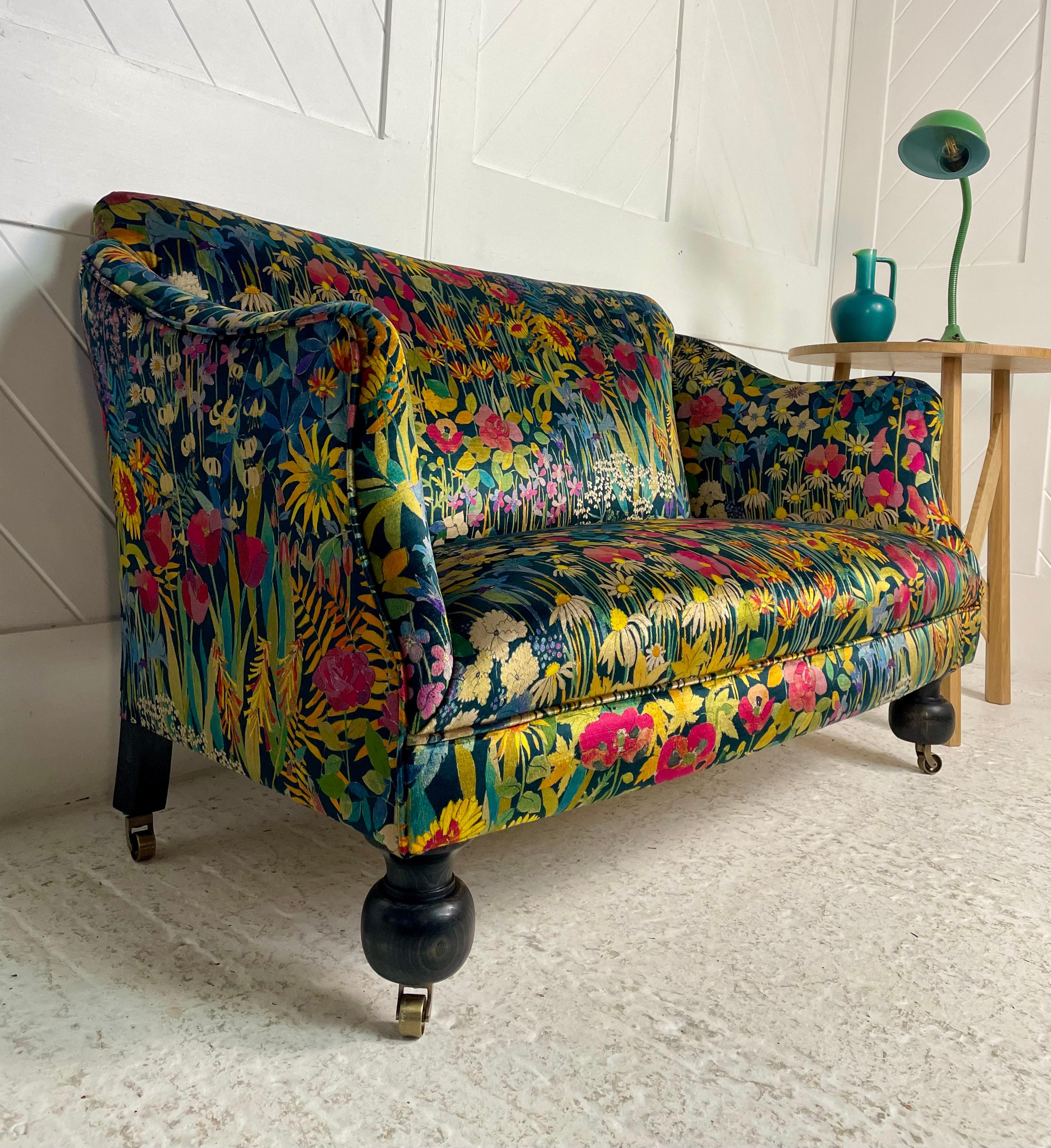 A modern small hand made settee in the ‘1920’s’ style, 

Traditionally upholstered beech wood frame with turned ebonised beech wood feet raised on brass castors.

Patch came across this settee 15 years ago and was amazed at its dinkey proportions
