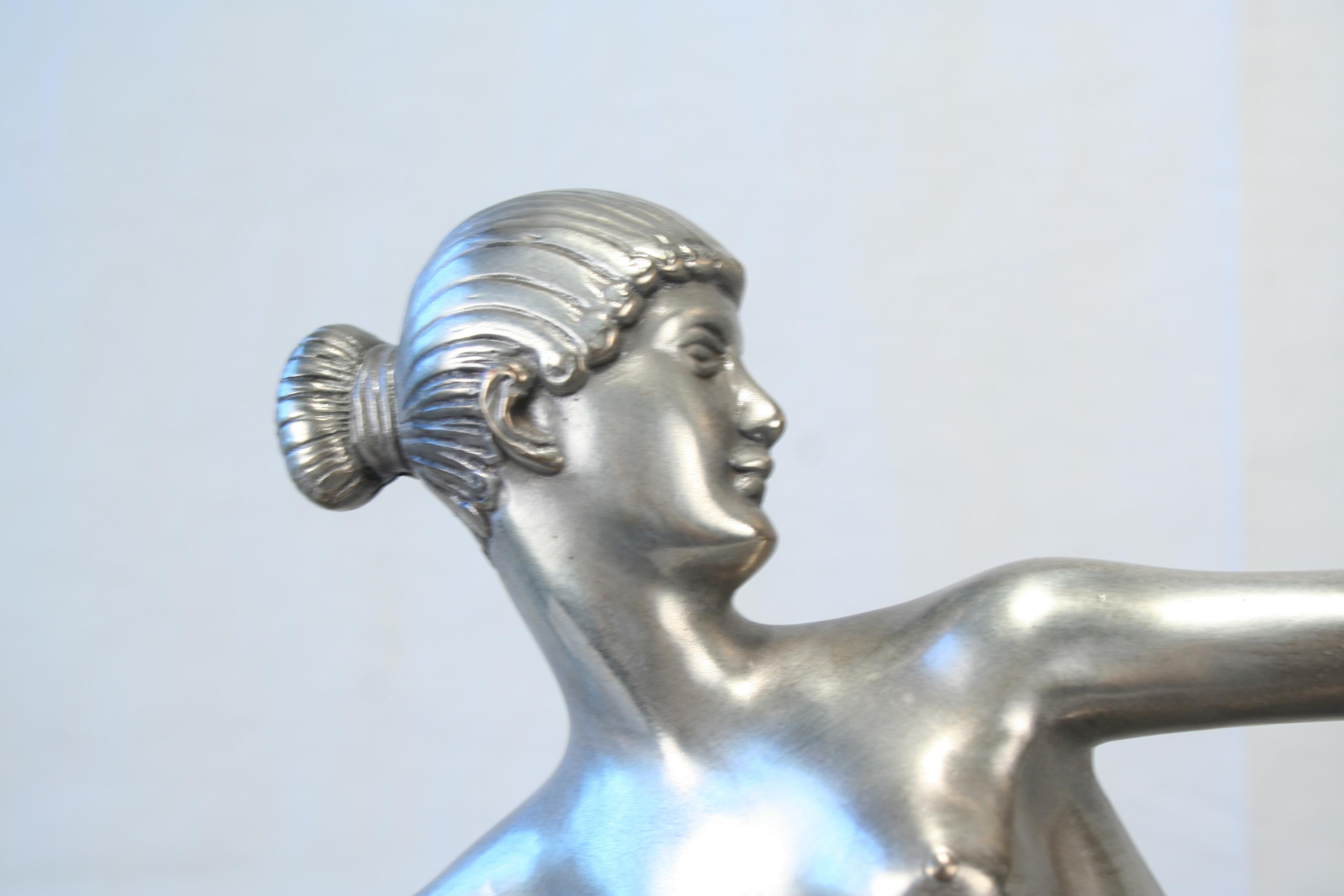 A popular designed Art Deco Lamp ,cast in lost wax Bronze and high polished finish of (Antique Silver ) . Has an Art Glass shade in Crinkle Glass at 6