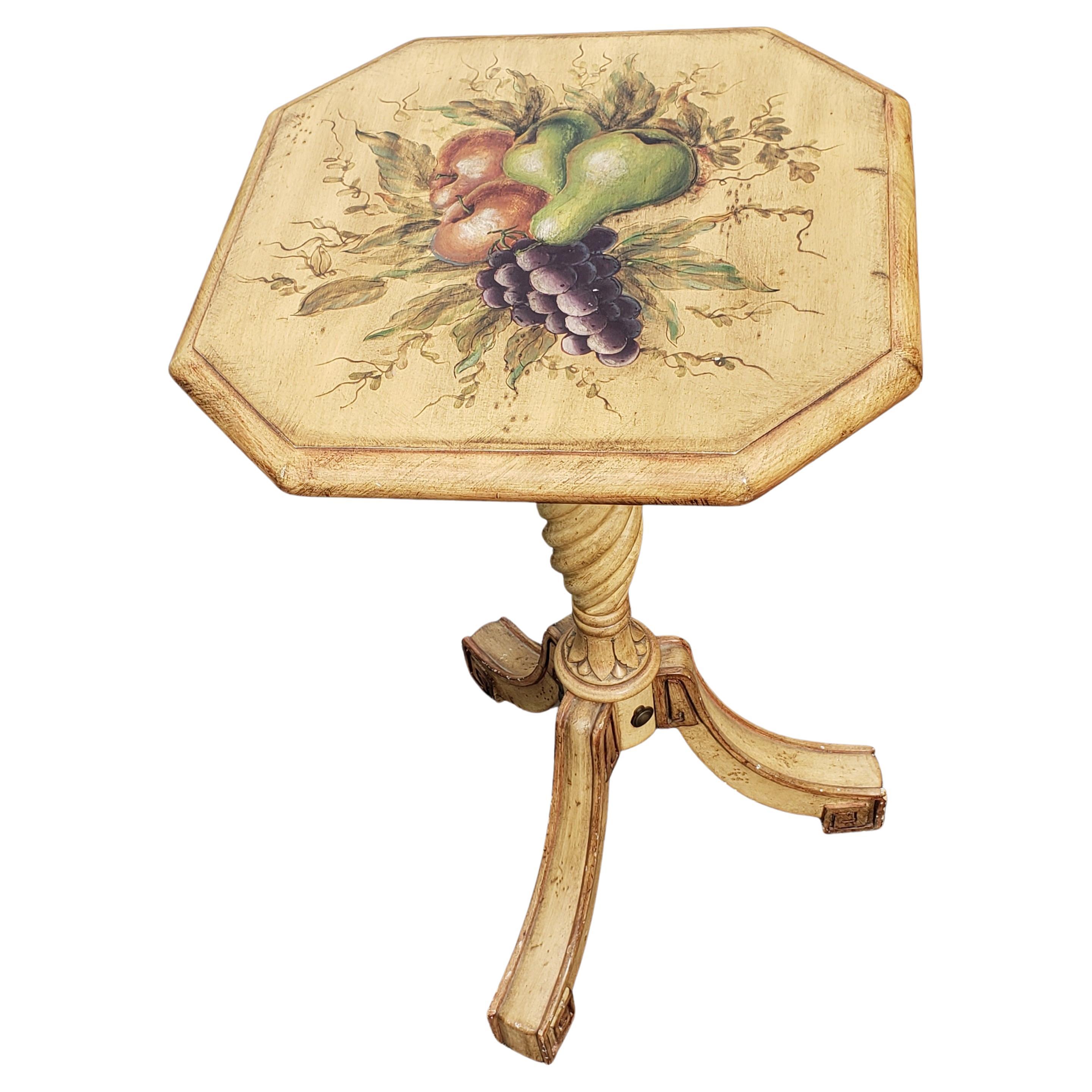 A modern decorated painted tripod pedestal tilt-top side table, painted in antique white/ cream background color with fruits painting on top.

Measures 15.25