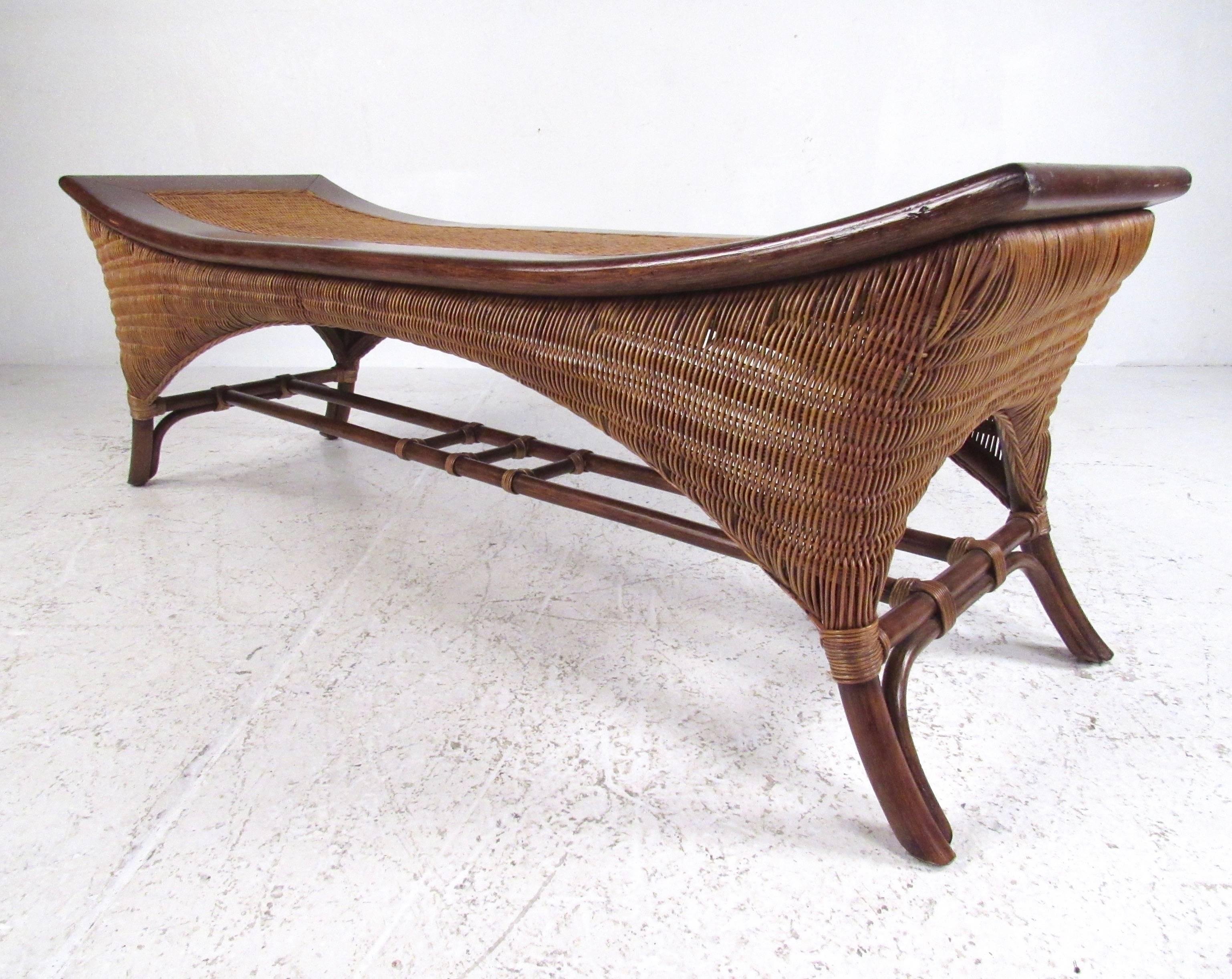 This contemporary wicker bench features unique modern design and striking two-tone hardwood or wicker construction. The shapely design of the legs is accentuated by side-to-side stretchers, making this a beautiful seating option for any interior.