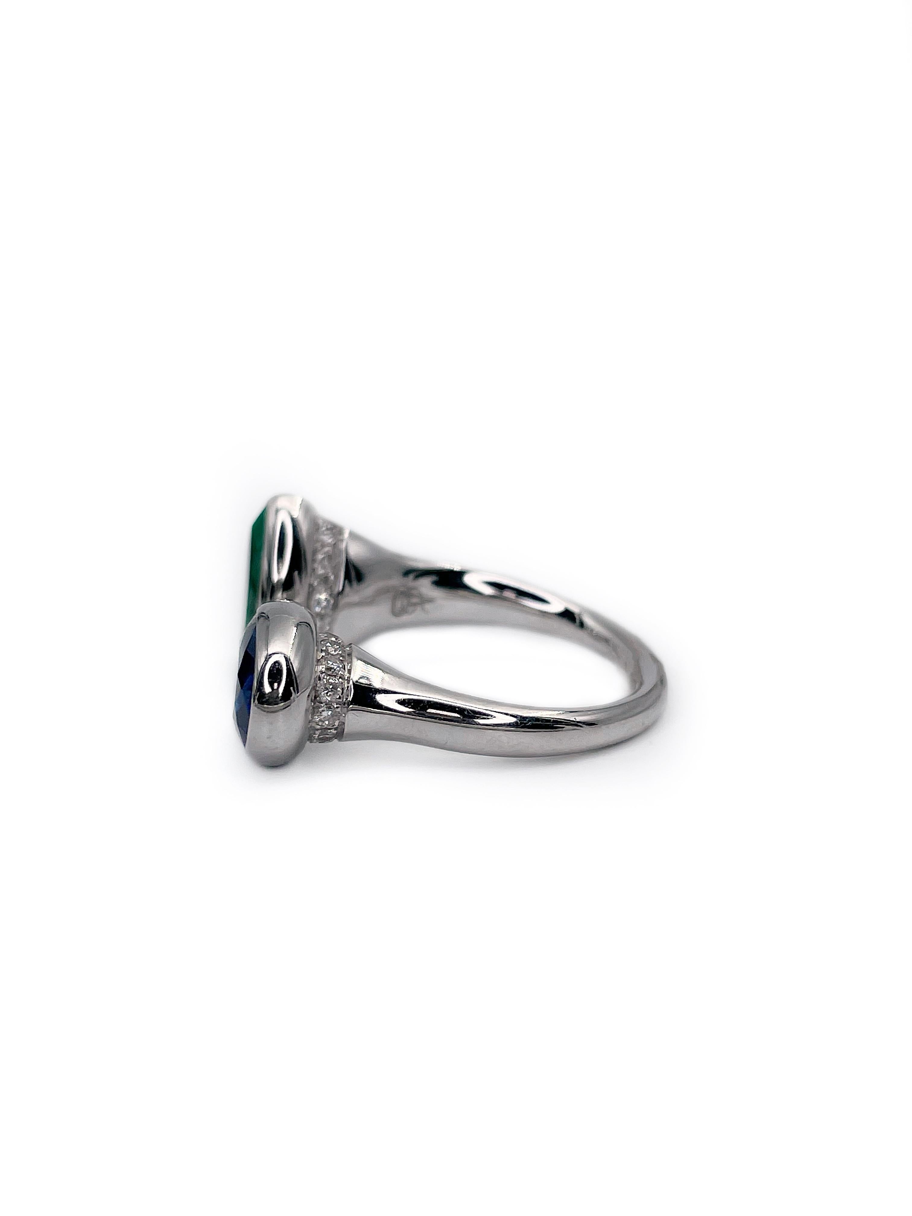 This is an open “Toi et moi” design ring in 14K white gold. It features a stunning pear shape 1.5ct natural very slightly bluish green emerald and oval shape natural heated 2.2ct violetinish blue sapphire. The gallery is subtly decorated with 29