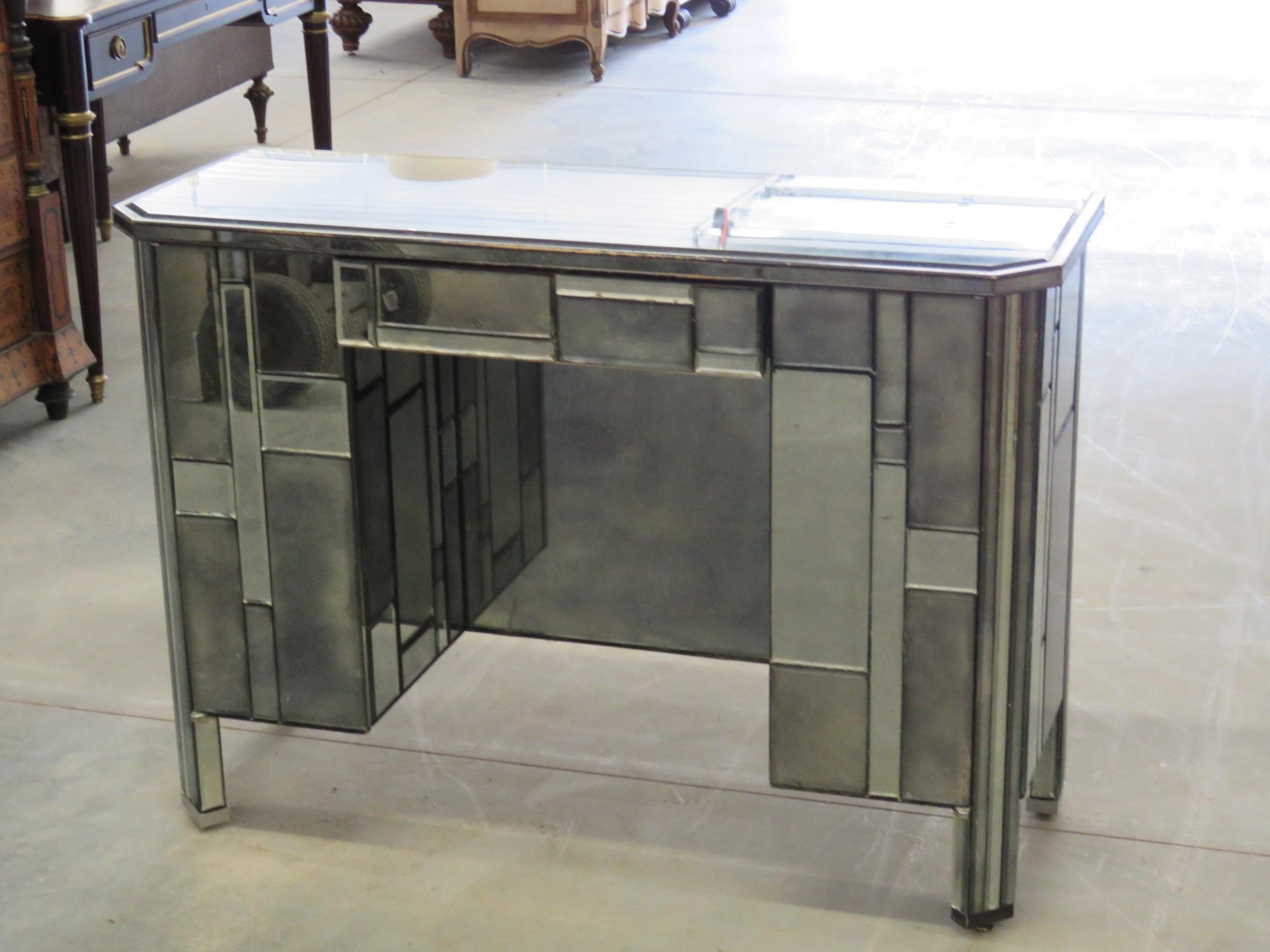 French Art deco desk with antique patinated mirrored panels having one drawer and two side doors that each contain 1 drawer.