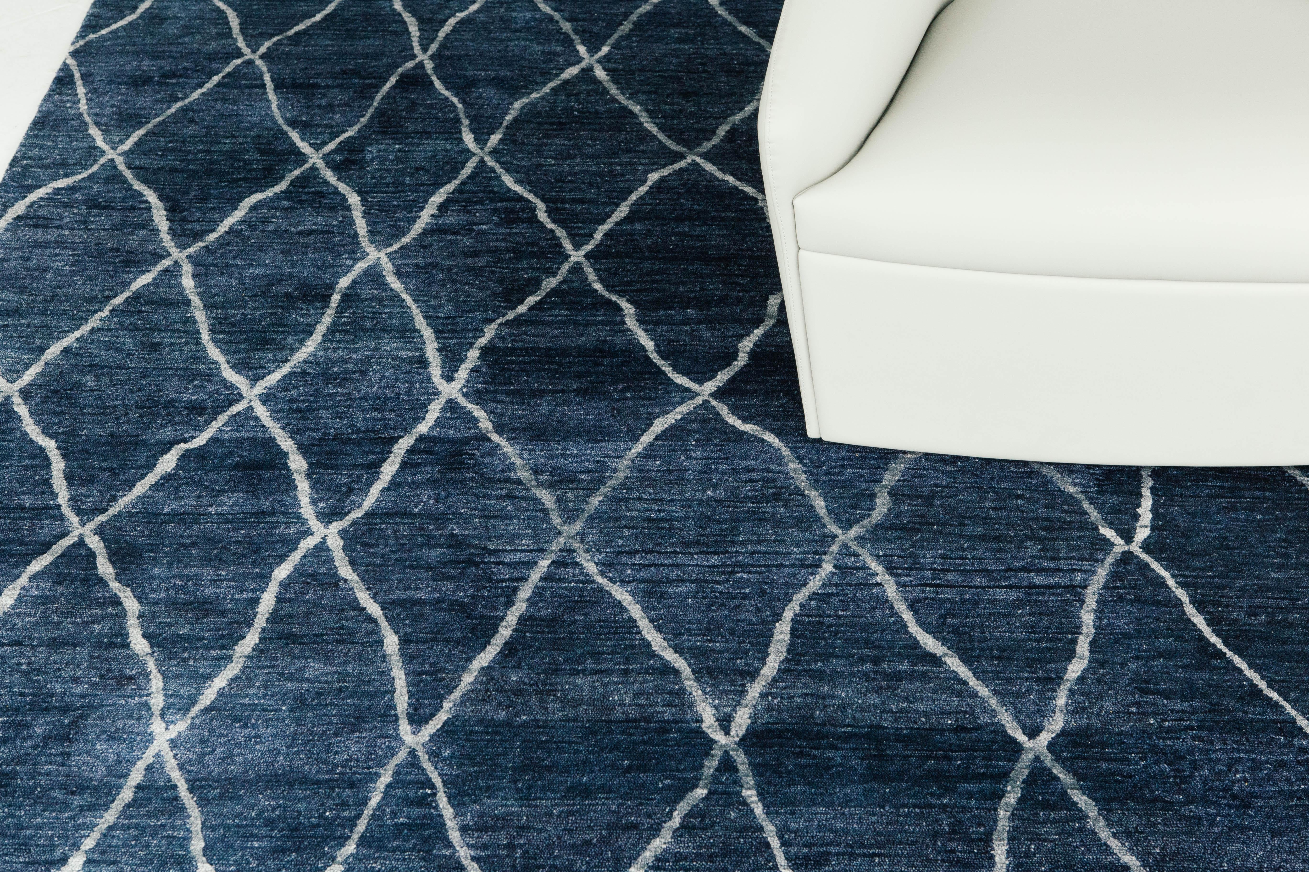 'Palisade' is the perfect bamboo silk rug in a deep ocean blue. The rug's sheen and organic light blue line work truly gives the rug an effortlessly chic and luxurious look. Palisade's lustrous silks bring movement to the rug like ocean waves