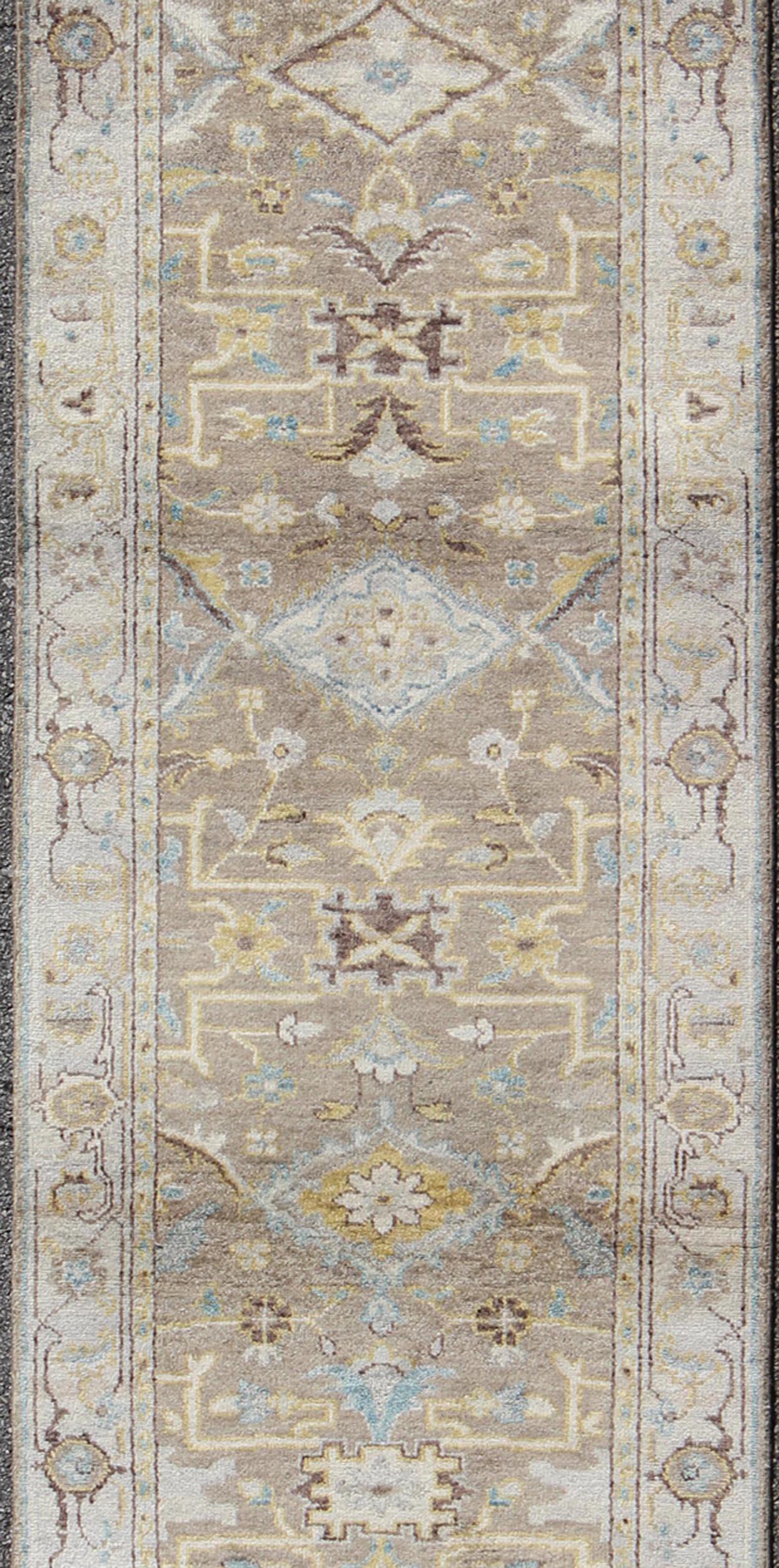 This Modern Heriz Runner features a an all-over uniquely accentuated design; using light and earthy tones which make the rug a great fit for a variety of transitional and traditional interiors.

Long Heriz runner in all over geometric design,