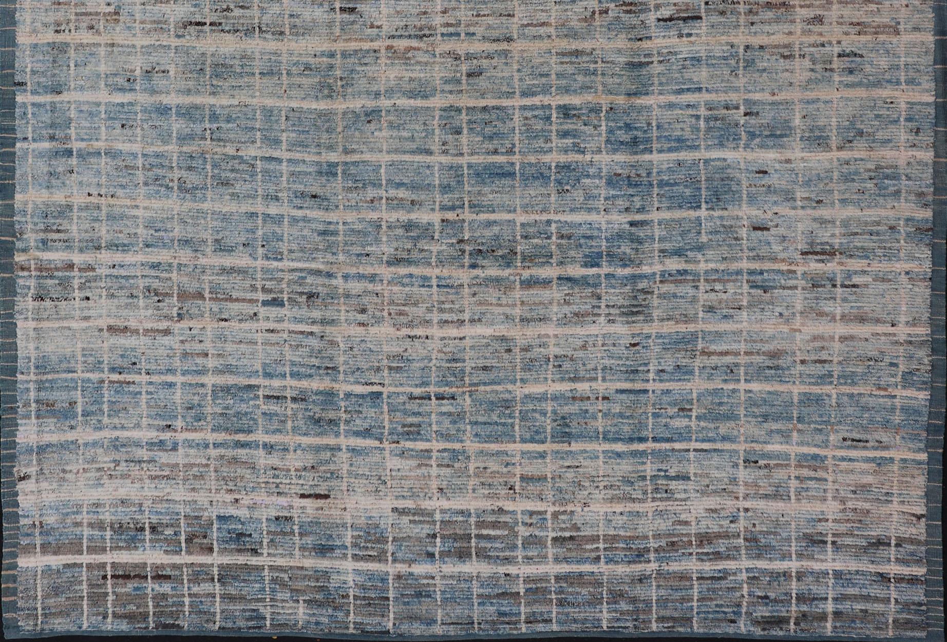 Modern Moroccan Rug by Keivan Woven Arts in Variegated Blue. Keivan Woven Arts rug AFG-30606, country of origin / type: Afghanistan /Modern Casual.
Measures: 9'6 x 11'8.
This modern design and modern colored piled rug it a perfect option for modern