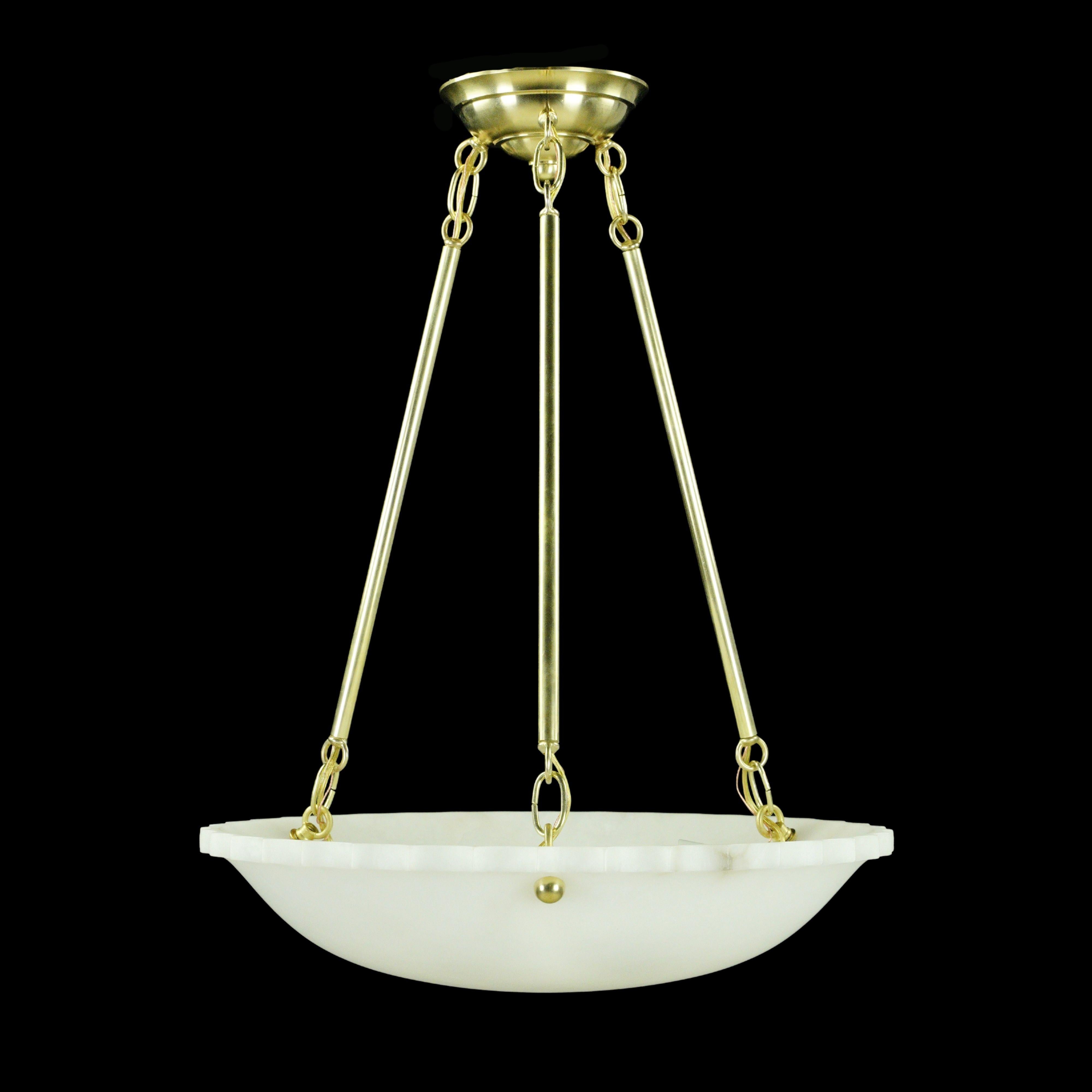 Brass triple arm hardware holds this white carved alabaster bowl dish light. This light is wired and ready to ship. Good condition with appropriate wear from age. New hardware. One available. Cleaned and restored. Please note, this item is located
