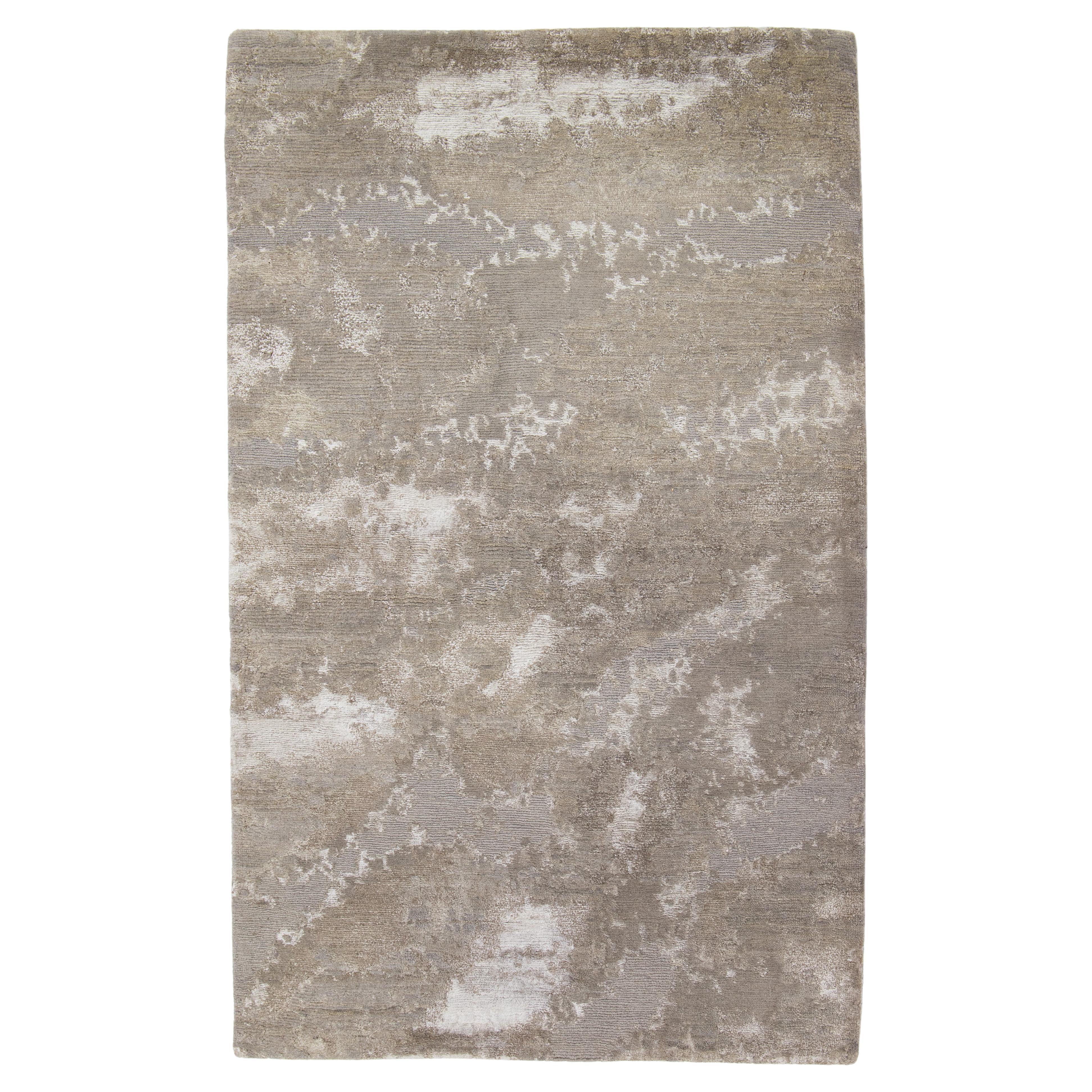 Tappeto in lana e seta di bambù dal design moderno nei colori grigio e beige