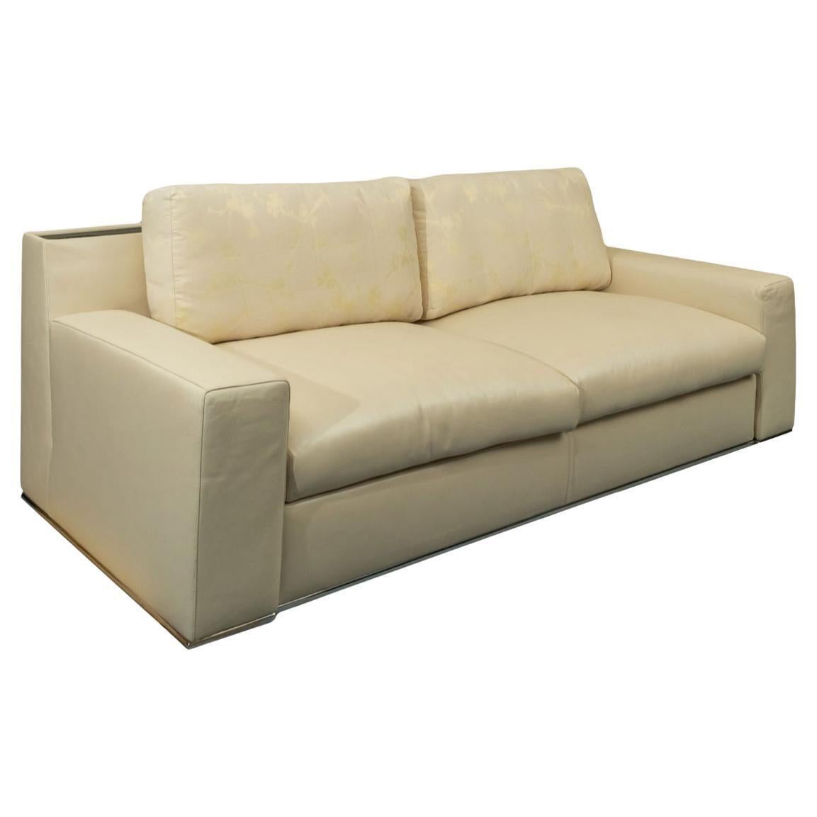Beautiful Modern Designer Fendi Casa cream leather sofa with back drink shelf. Authentic Fendi Casa Italian modern designer sofa, featuring soft light cream leather upholstery with black lacquered cocktail inserts on the back and chrome metal trim