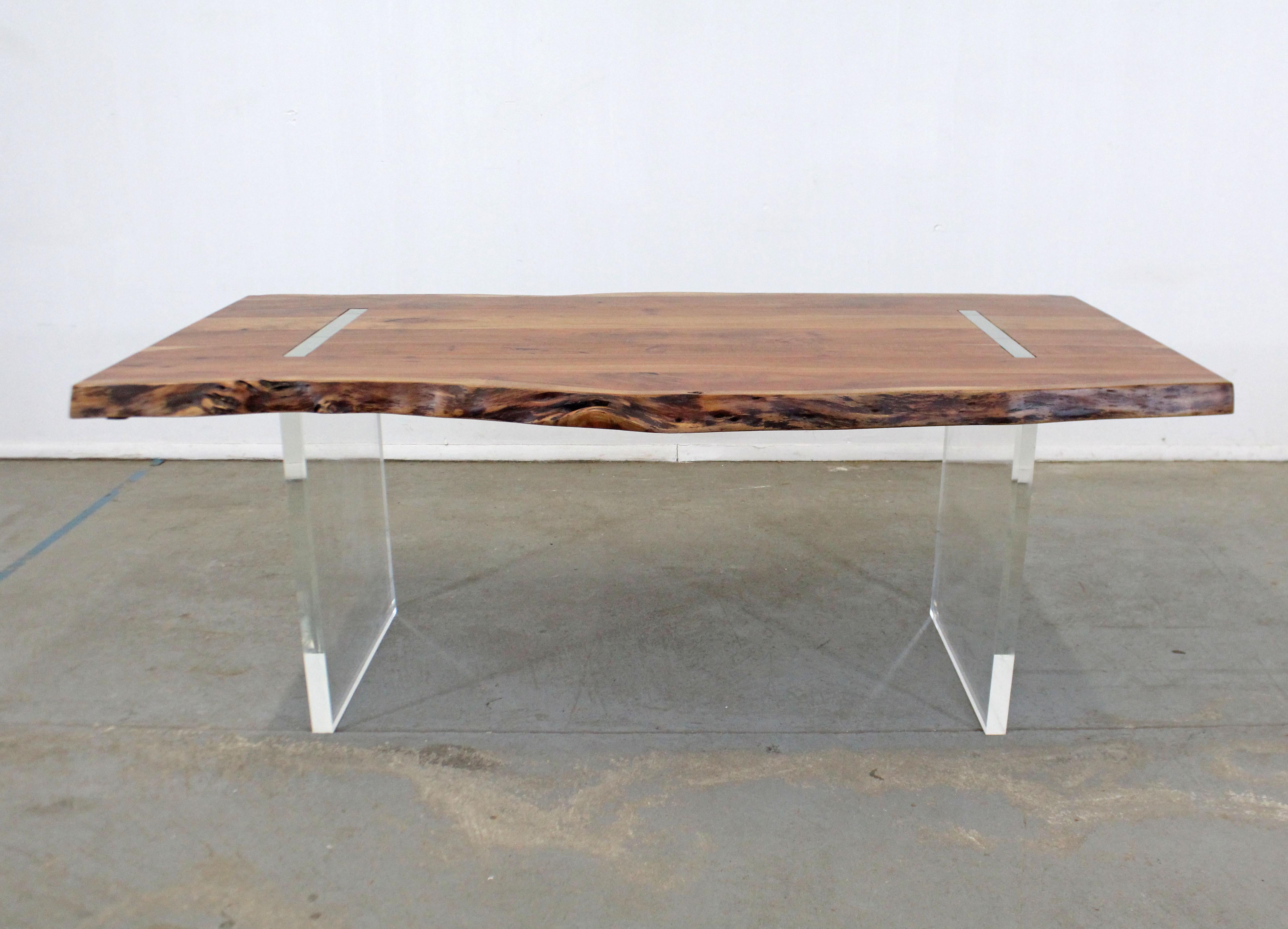 Offered is a one-of-a-kind modern dining table. This is a heavy custom made studio design table featuring a live-edge Acacia slab wood 