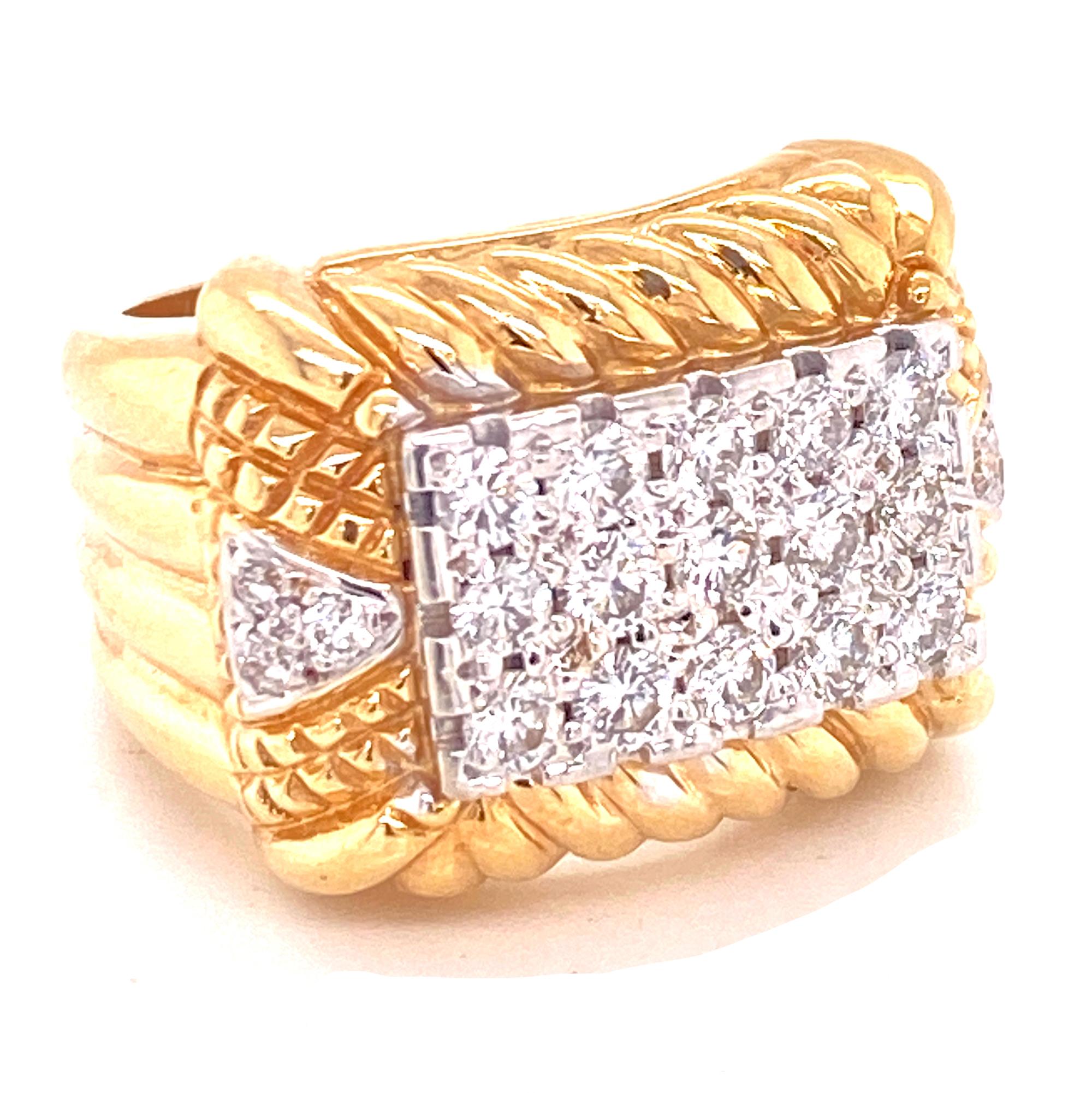 Modern diamond cable ring fashioned in 14 karat yellow gold. The cable textured ring features 21 round brilliant cut diamonds (1.15 CTW) graded F-H color and VS2-SI1 clarity. The ring measures 16mm in width, and is currently size 6 (can be sized ). 