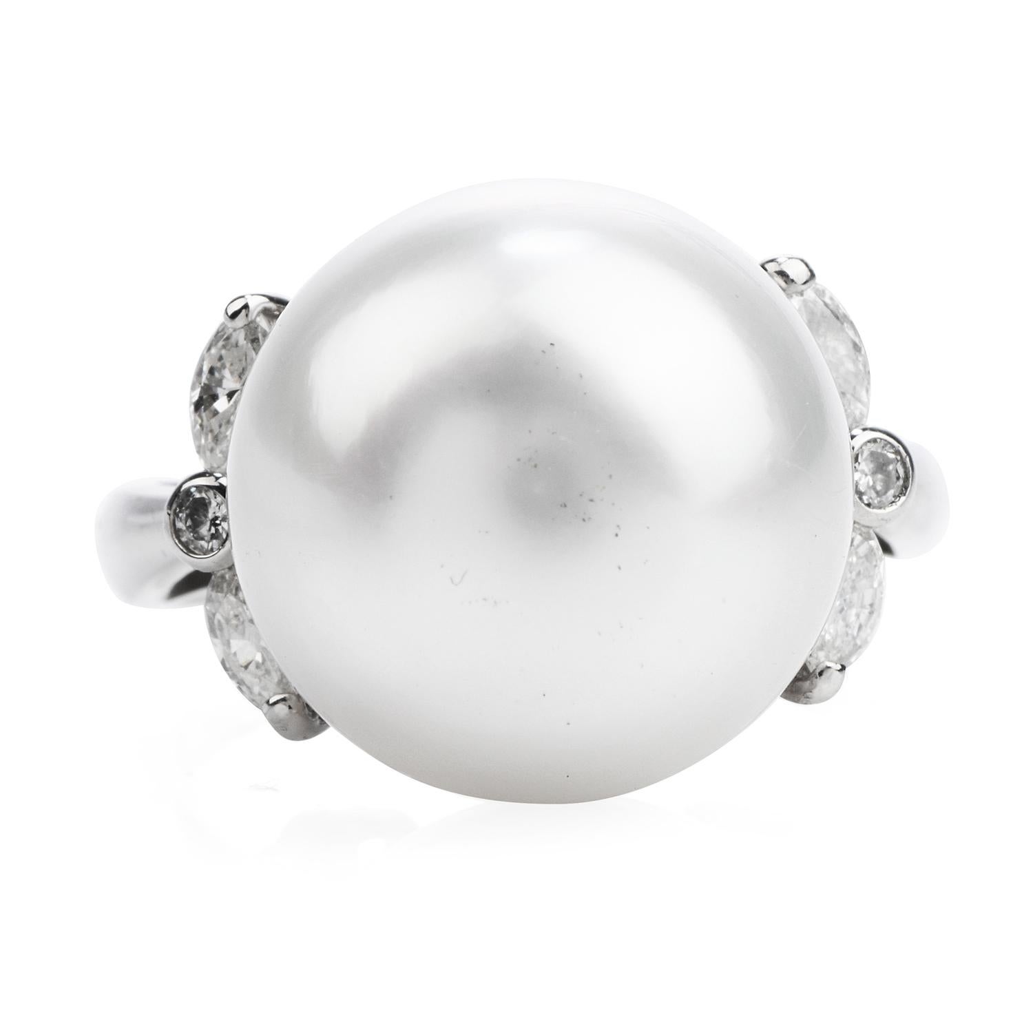 This elegant pearl and diamond ring are crafted in solid platinum, weighing 9.9 grams and measuring 14mm x 15mm high.

Showcasing a lustrous South Sea pearl of white tone, measuring 14mm.

Aside from 2 prong-set round-cut diamonds and 4 prong-set