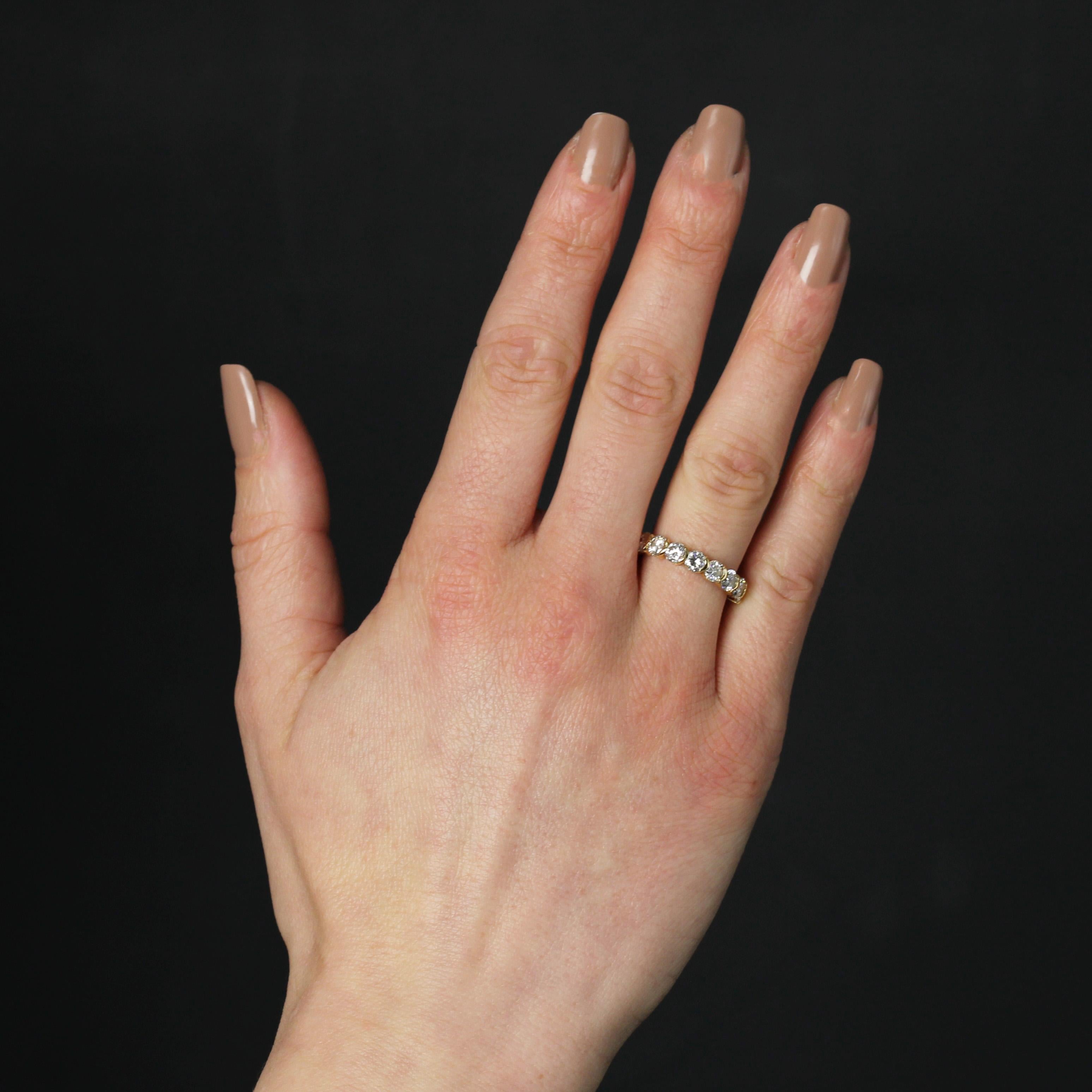 Ring in 18 karat yellow gold.
A magnificent diamond wedding band, set on the front with 8 modern brilliant-cut diamonds.
Total weight of diamonds : 1.40 carat approximately.
Height : 3.7 mm approximately, width : 3.5 cm approximately, thickness :