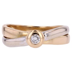 Bague moderne entrelacée en or jaune et blanc 18 carats avec diamants