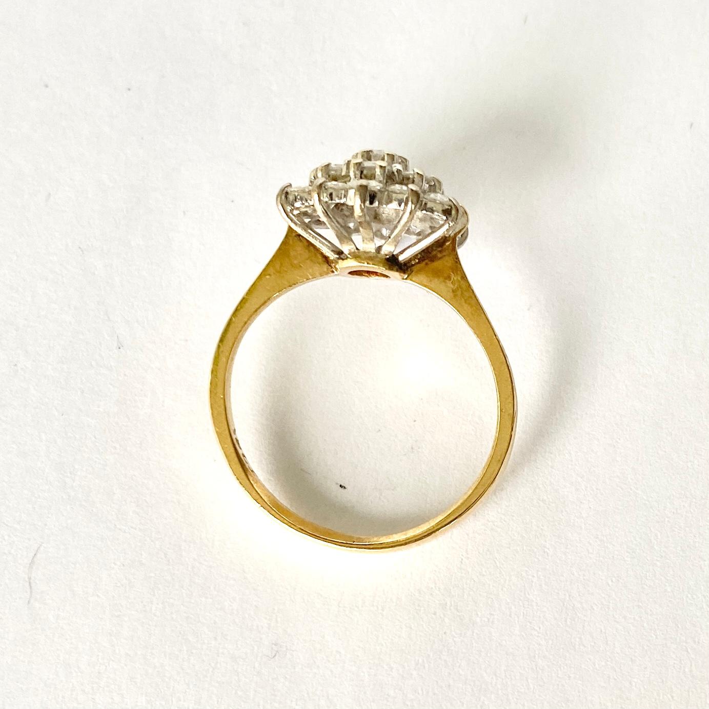 This cluster ring holds Diamonds totalling approx 1ct and are bright and sparkly. The stones are placed up high on an open work gallery, they are also set in platinum. 

Ring Size: K 1/2 or 5 1/2 
Cluster Diameter: 12mm
Height From Finger: