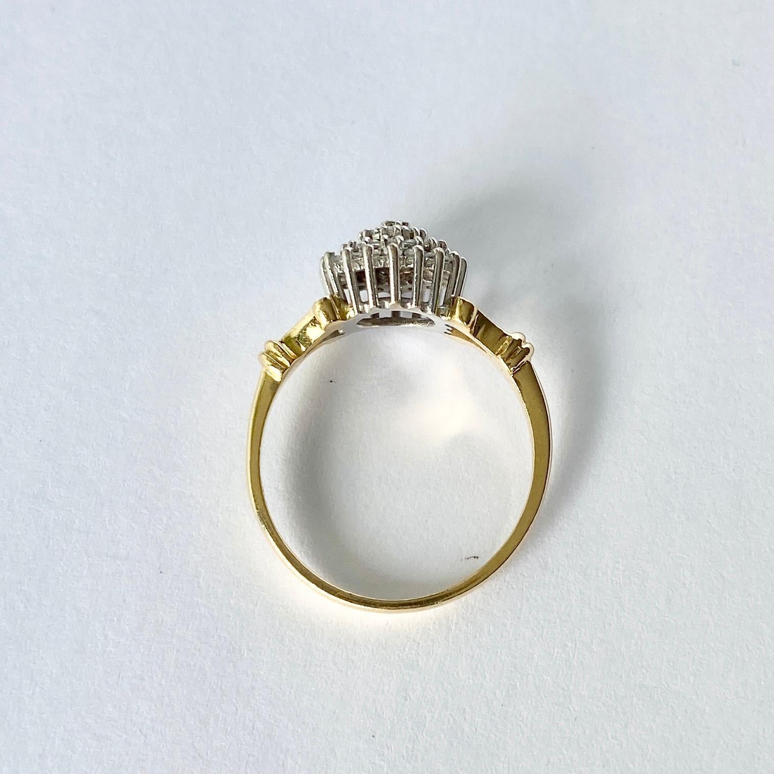 This cluster ring holds Diamonds totalling approx 40pts and are bright and sparkly. The stones are placed up high on an open work gallery, they are also set in platinum. The rest of the ring is modelled in 18carat gold and has wonderful split