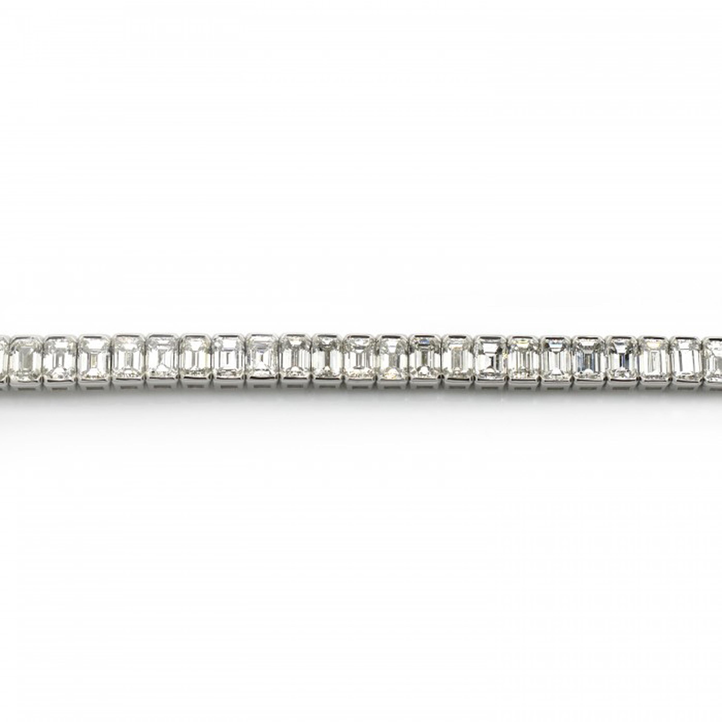 A diamond line bracelet, featuring sixty emerald-cut diamonds, with a total weight of 14.84ct, individually hinged, mounted in platinum.