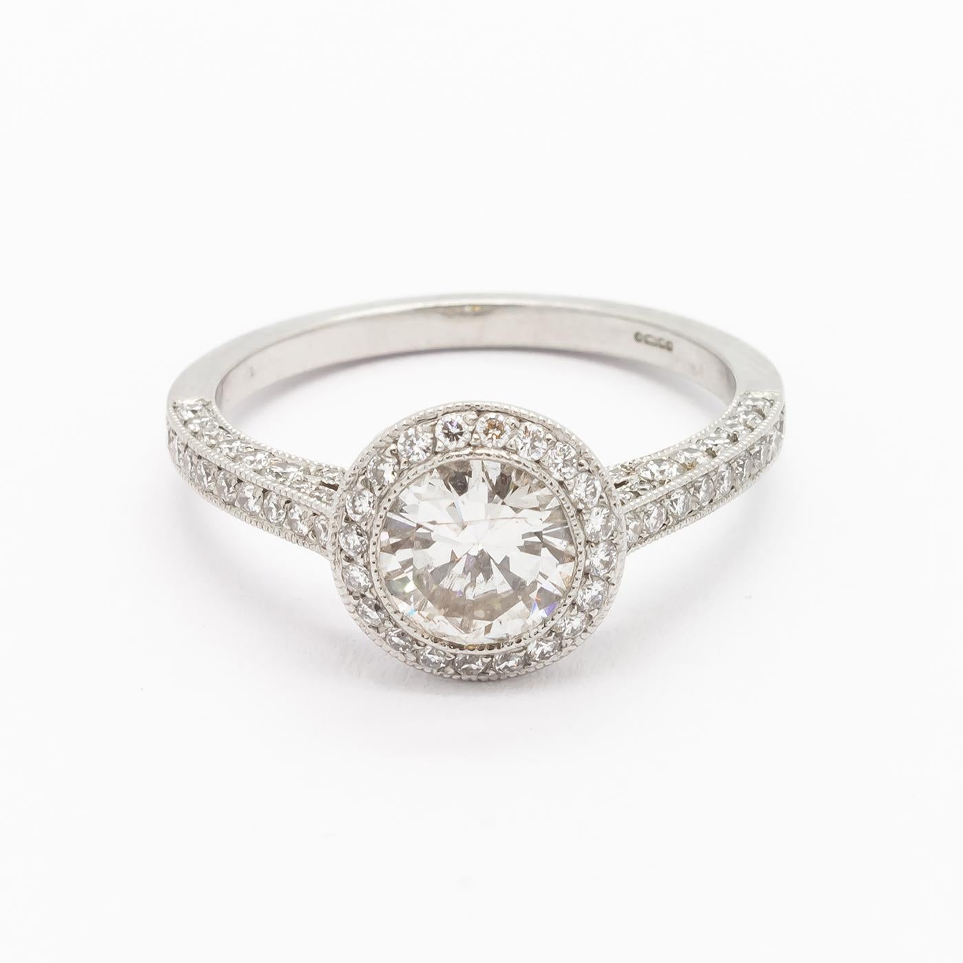 Round Cut Modern Diamond and Platinum Micro Pavé Halo Ring, 0.85 Carats For Sale
