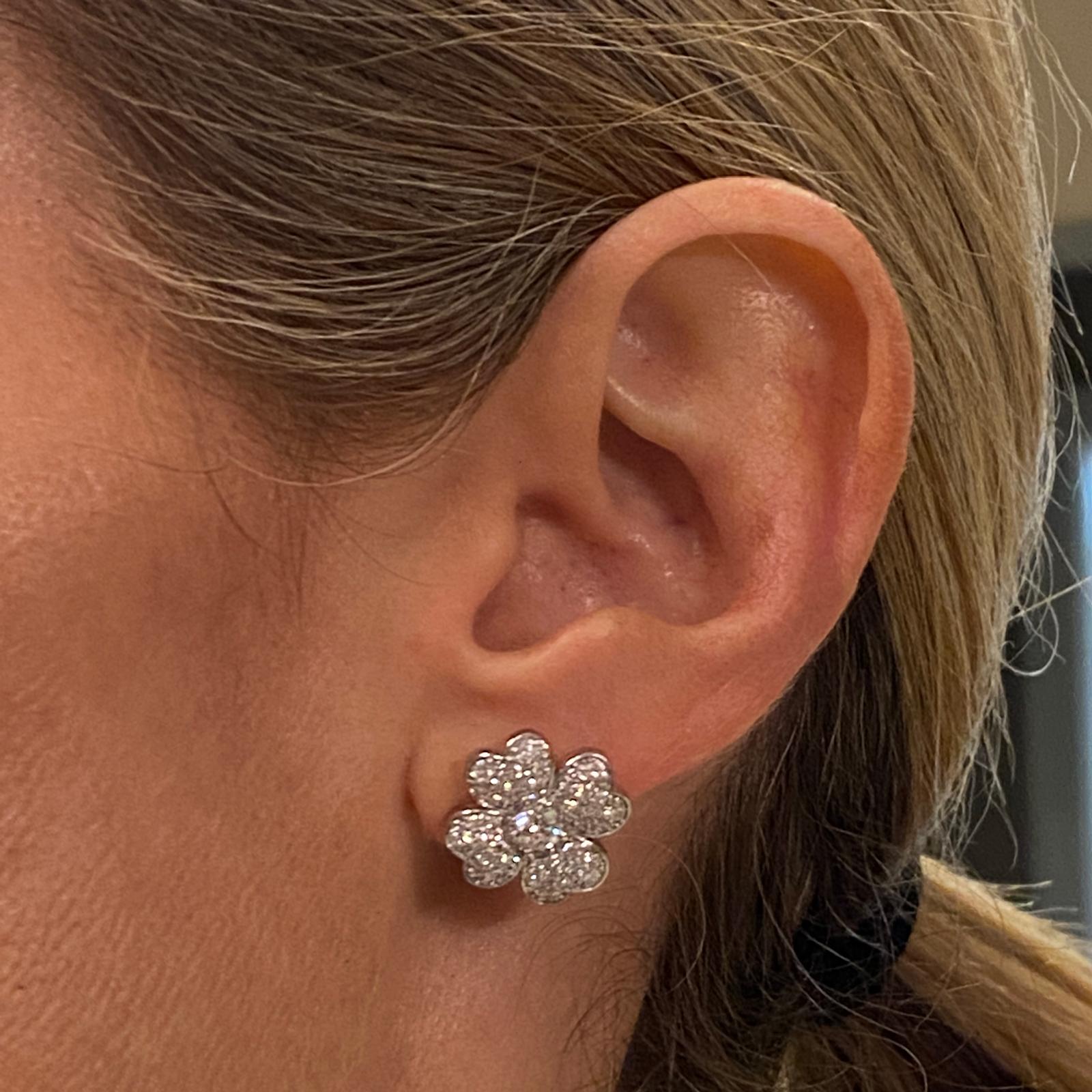 Beautiful diamond clover earrings fashioned in 18 karat white gold. The earrings feature 2 round brilliant cut diamonds weighing .50 carat total weight and another 96 round brilliant diamonds weighing 1.42 carat total weight ( 1.92 CTW). The