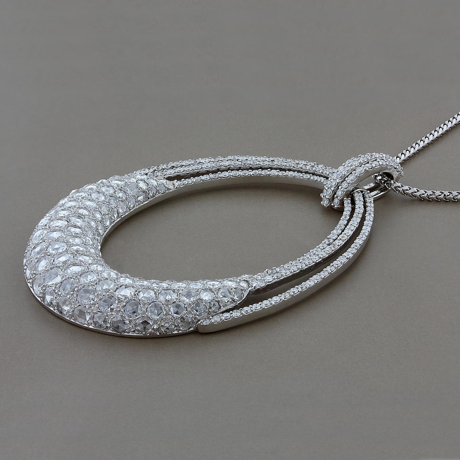 A wonderfully unique and substantial diamond pendant featuring 8.40 carats of rose cut and round cut diamonds set in 18K white gold. Beautiful shine and sparkle radiate from this piece which comes with a 24 inch gold chain.

Dimensions: 2.75 x 1.85