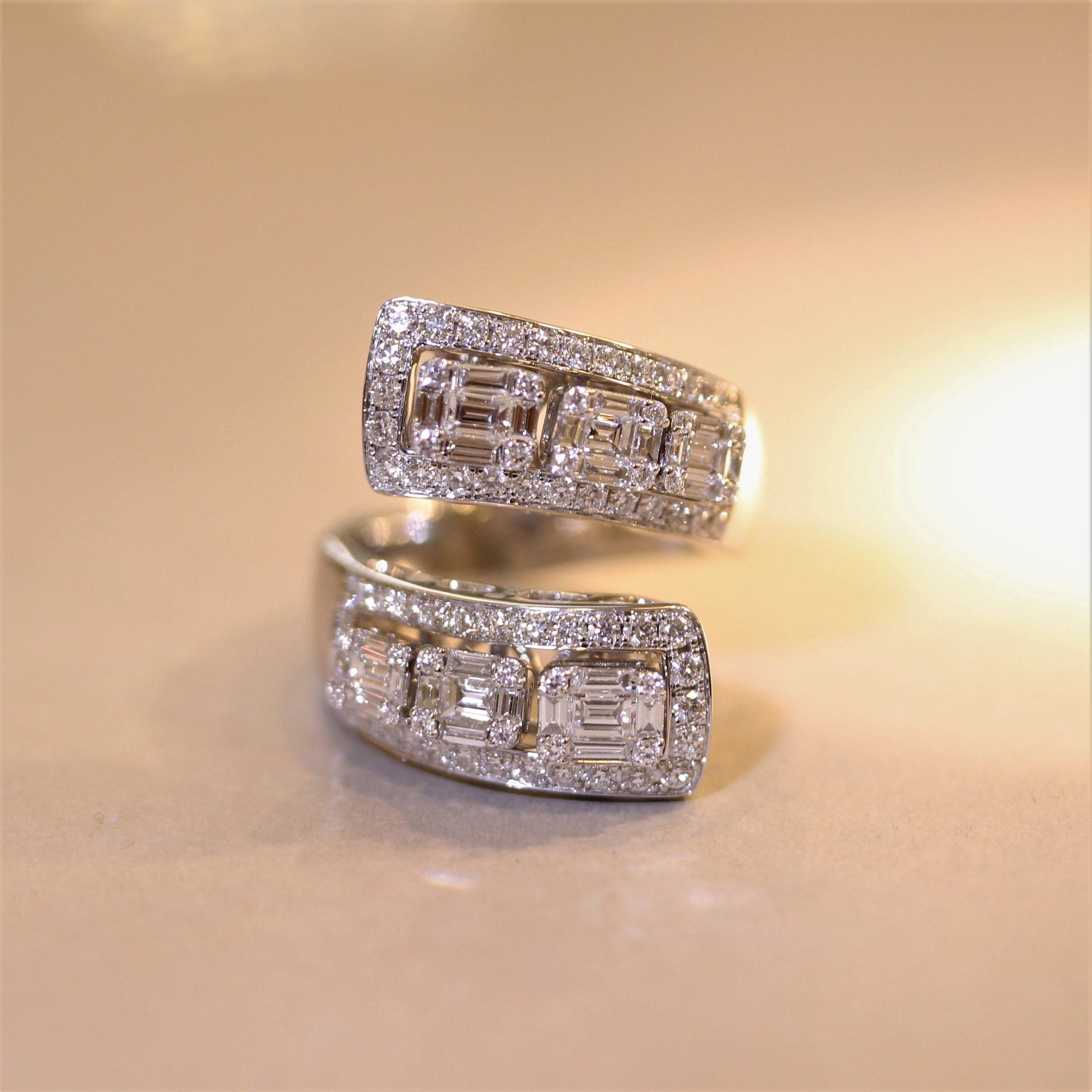 A unique, fine, and fun ring with movement! It features 2.90 carats of round brilliant-cut and baguette-cut diamonds. The two sides of the ring have 3 diamond studded gold studs that slide independently from one another. Secure in place and slides
