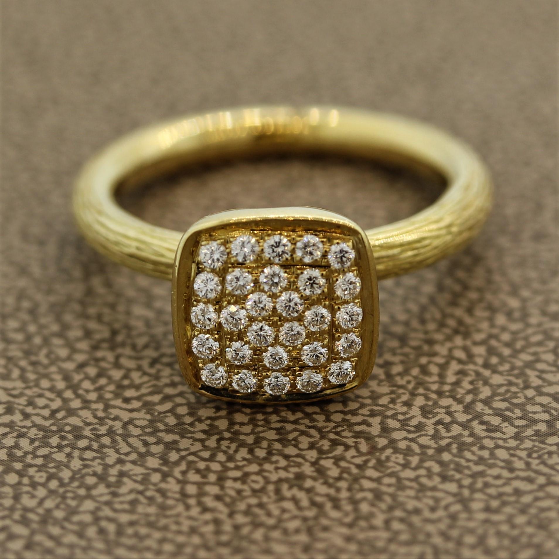 A modern styled gold ring featuring 0.24 carats of round brilliant cut diamonds which are set atop the ring. The sides of the ring are hand carved in a naturalistic style resembling the finishing of tree branches. Made in 18k yellow gold.  

Ring